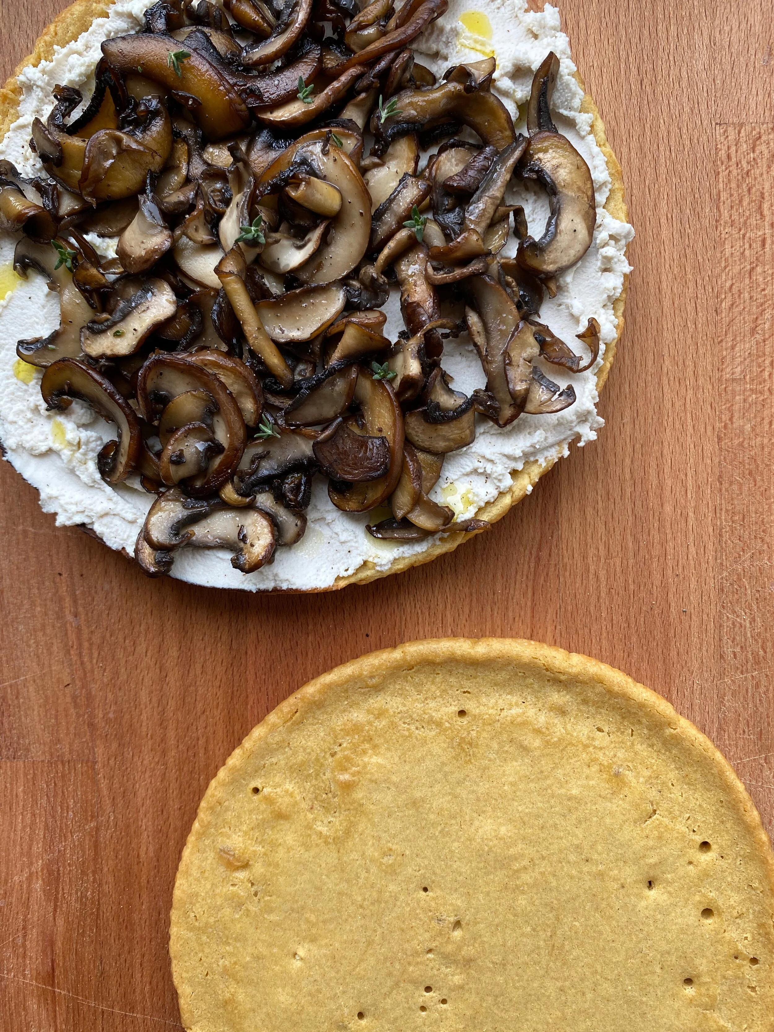 Socca topped with cashew ricotta and browned mushrooms (recipe below)