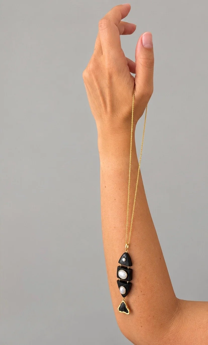 DRxTC-Lifestyle-Arm-Fish Pendant.jpeg