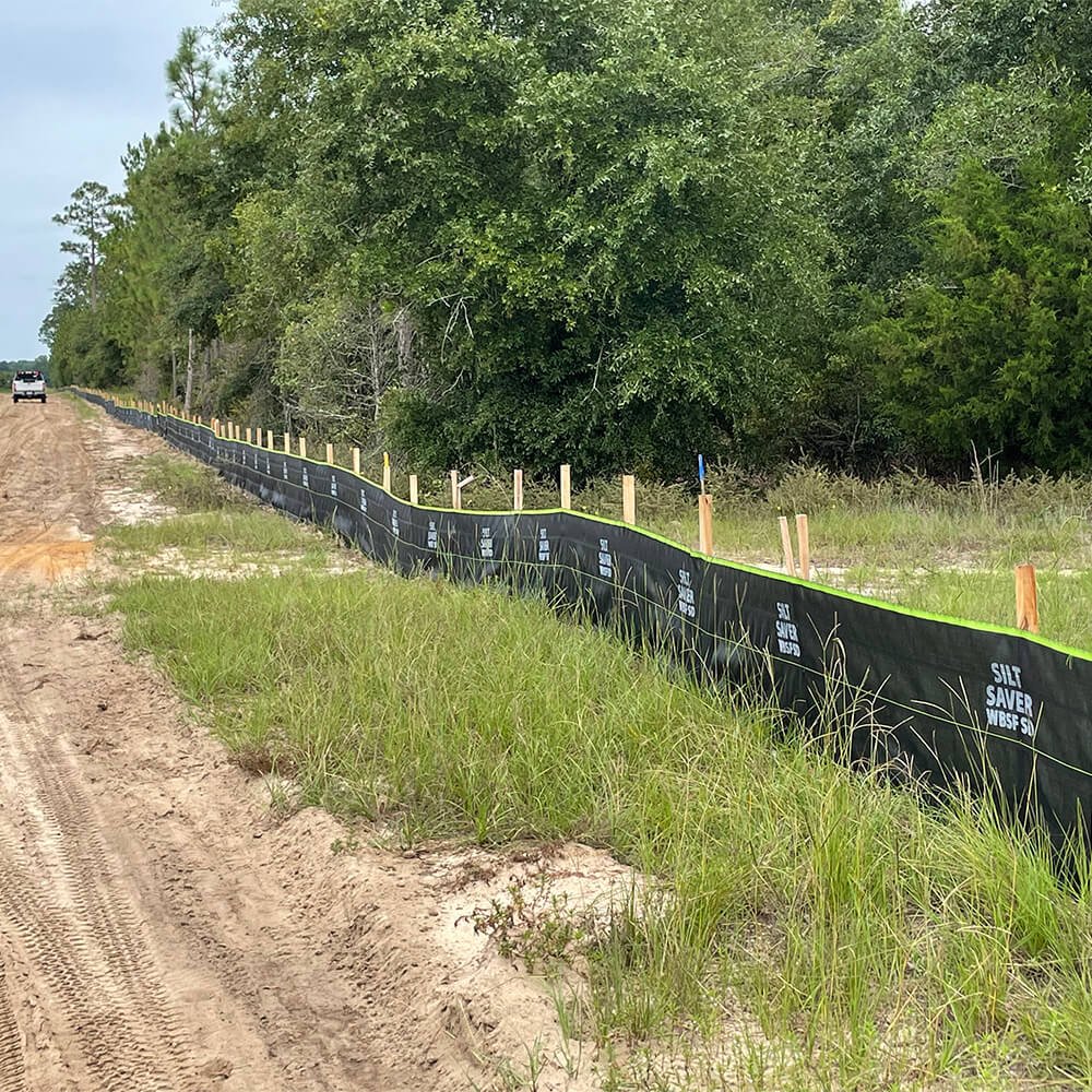 Silt Saver Woven Belted Silt Fence (WBSF) installed on border of jobsite.