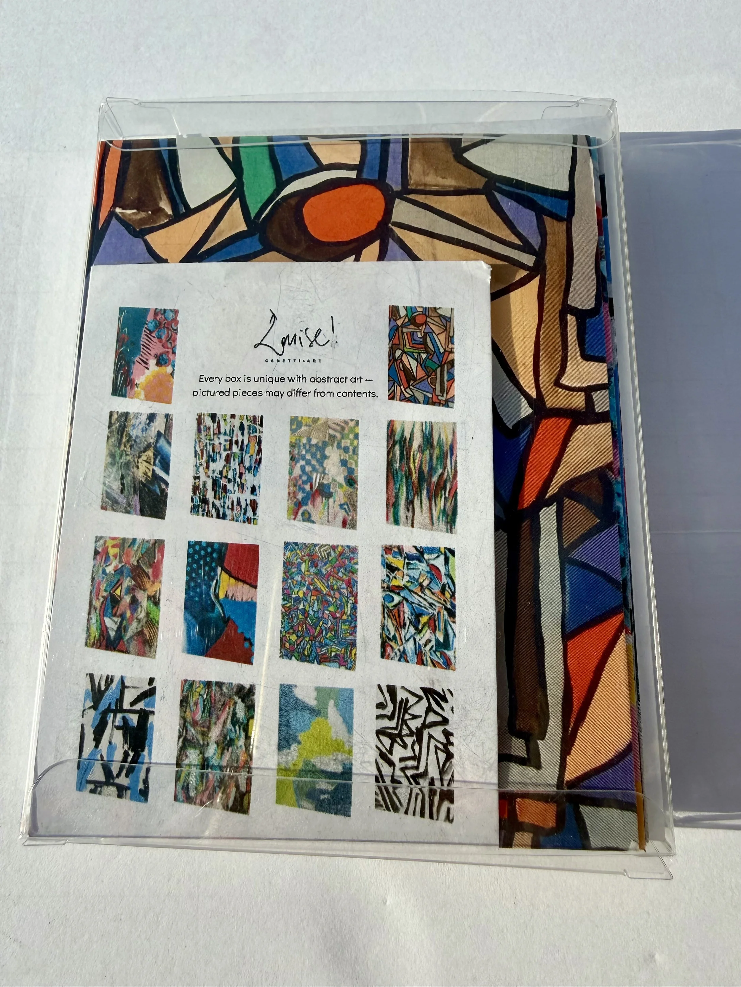 back side of Abstract box says, "Every box is unique with abstract art-pictured pieces may differ from contents."