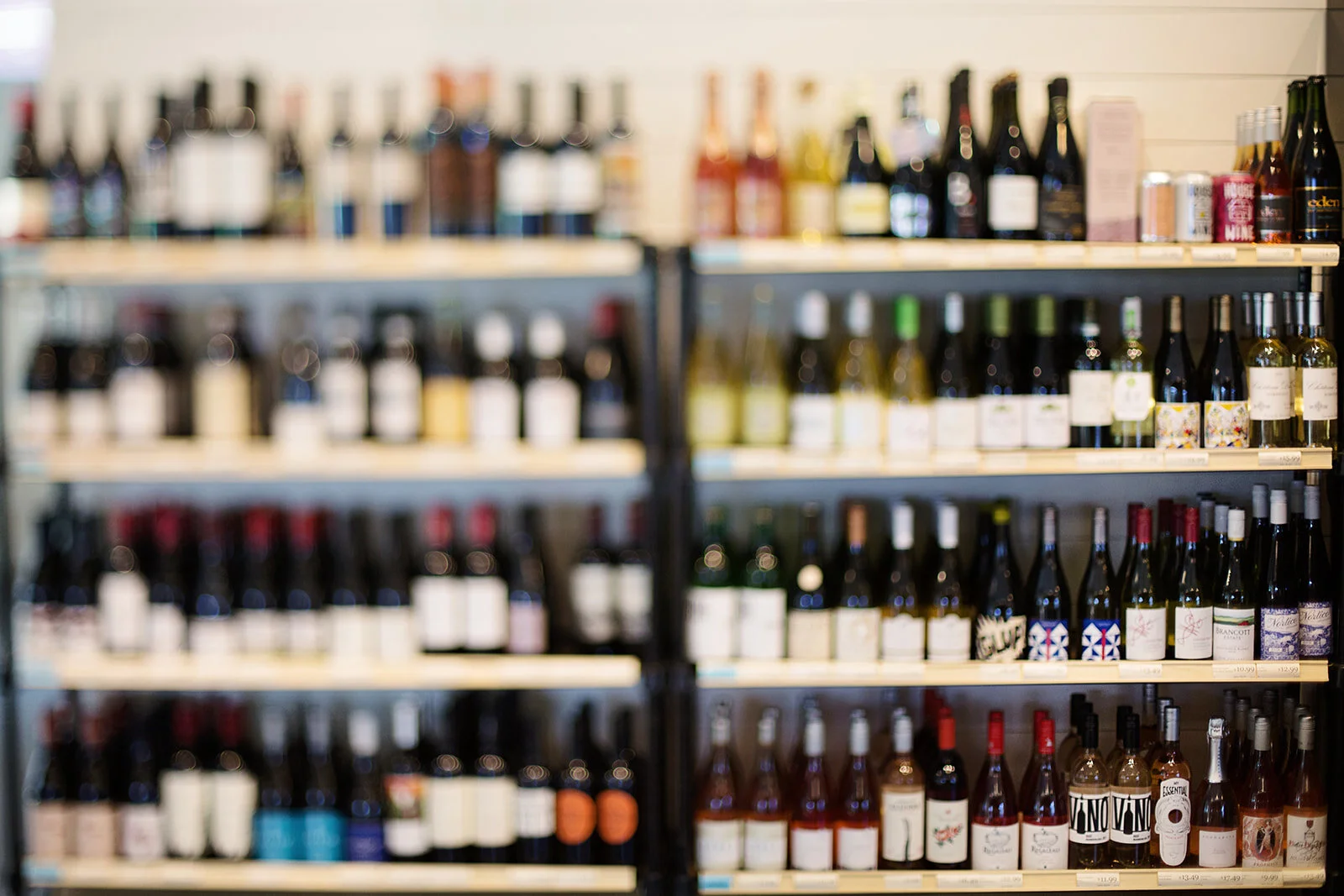 Shelves filled with bottled wine, slightly out of focus.