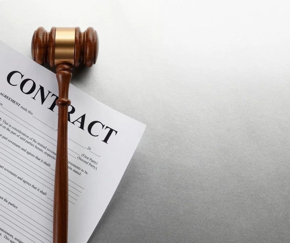 Signed contract document with a judge’s gavel, symbolizing real estate contract disputes and legal enforcement of purchase agreements.