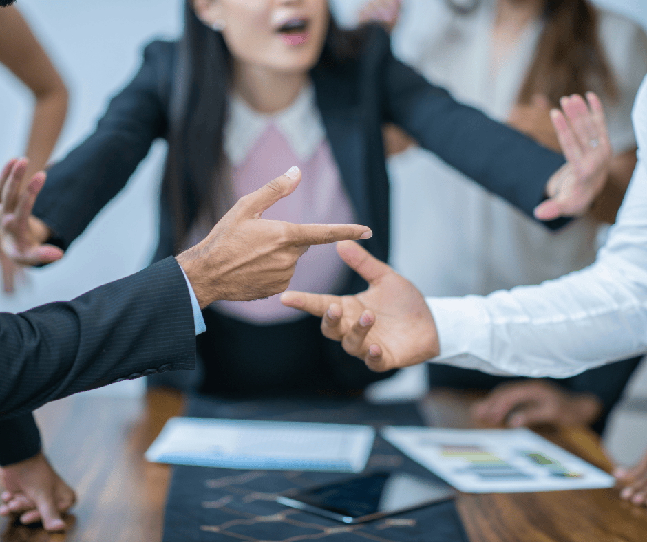 Group of individuals in a tense legal discussion over estate documents, representing contested wills and probate litigation disputes in Northeast Ohio.
