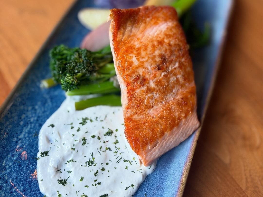 A fan fav - seared salmon with buttery garlic fingerling potatoes, broccolini &amp; horseradish cream. On the menu, every night! 🎣

#salmon #goodcatch #fishdinner