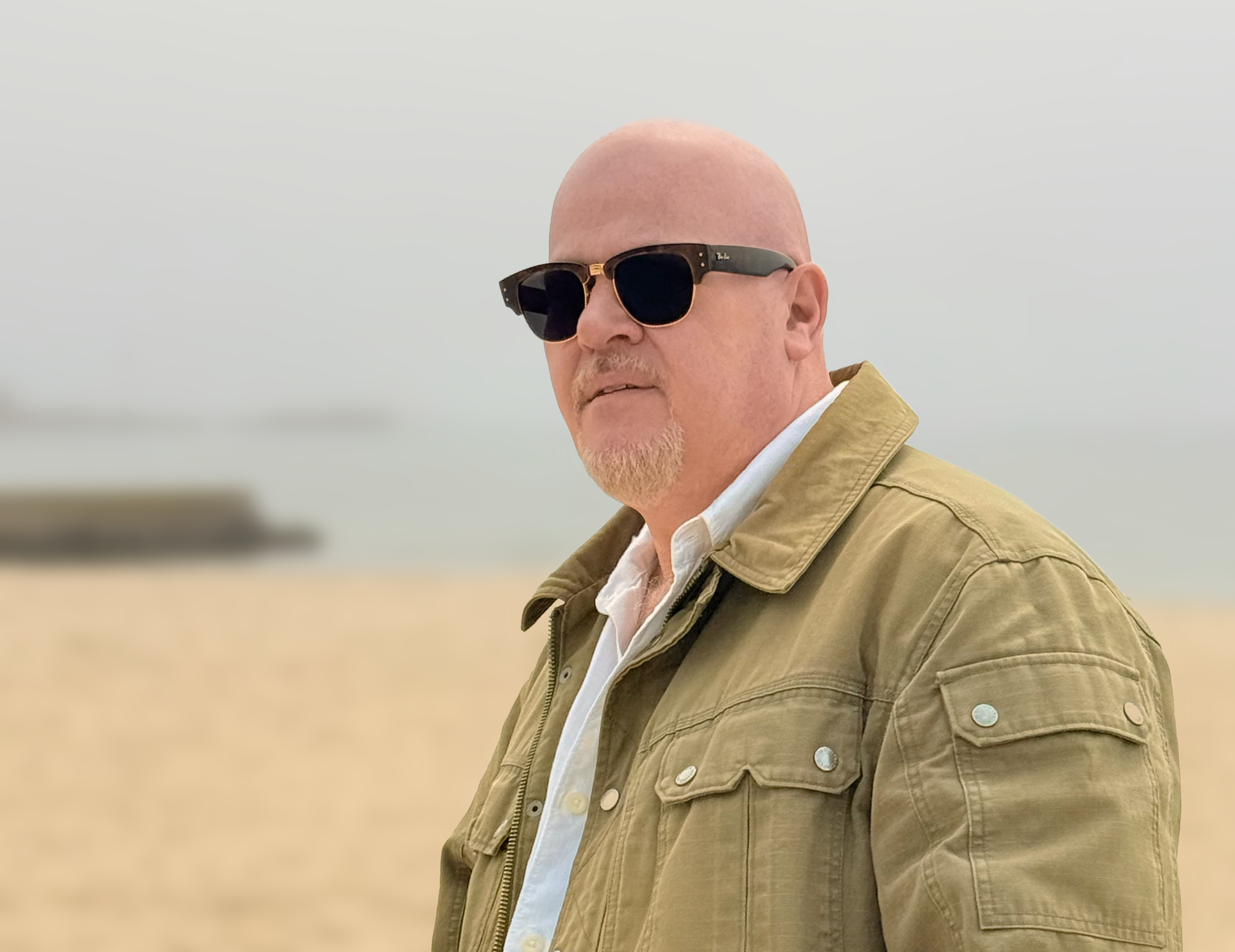 Me in dark glasses standing on a foggy beach