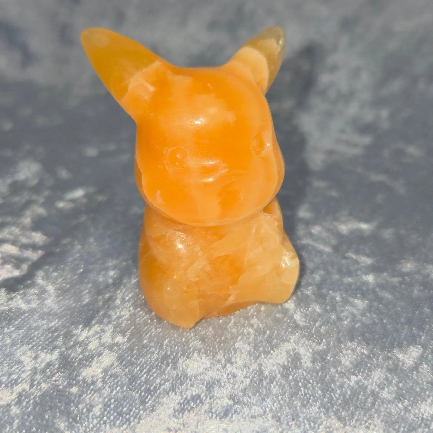 🍊𝐎𝐑𝐀𝐍𝐆𝐄 𝐂𝐀𝐋𝐂𝐈𝐓𝐄 𝐏𝐈𝐊𝐀𝐂𝐇𝐔🍊--$3️⃣0️⃣

𝗢𝗿𝗮𝗻𝗴𝗲 𝗖𝗮𝗹𝗰𝗶𝘁𝗲 is a joyful stone that can give one energy and motivation to overcome laziness and emotional stress. 😁 It can cleanse one's energy and help one to get through heavy