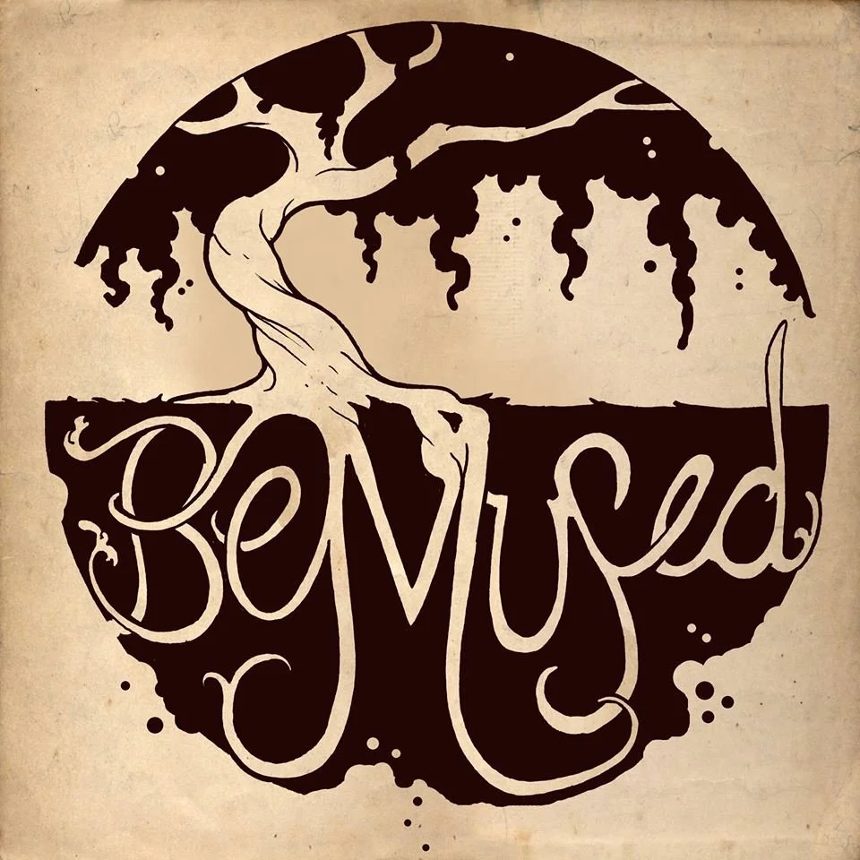 Artistic logo featuring a tree with hanging branches, integrated with the word 'BeMused' in stylized, swirling script.