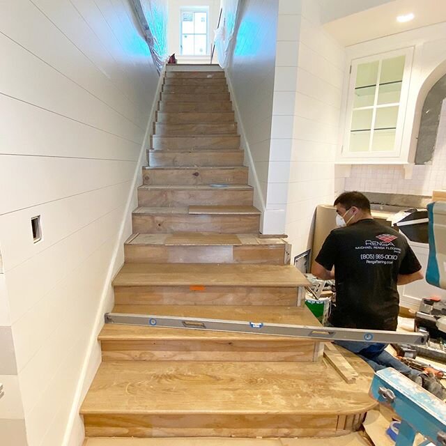 Going up 1 of 3 full staircases in this home with custom stair treads and paint grade wood risers that are mitered &amp; wrapping into the shiplap wall paneling for a seamless look 🙌 @ddfordconstruction
