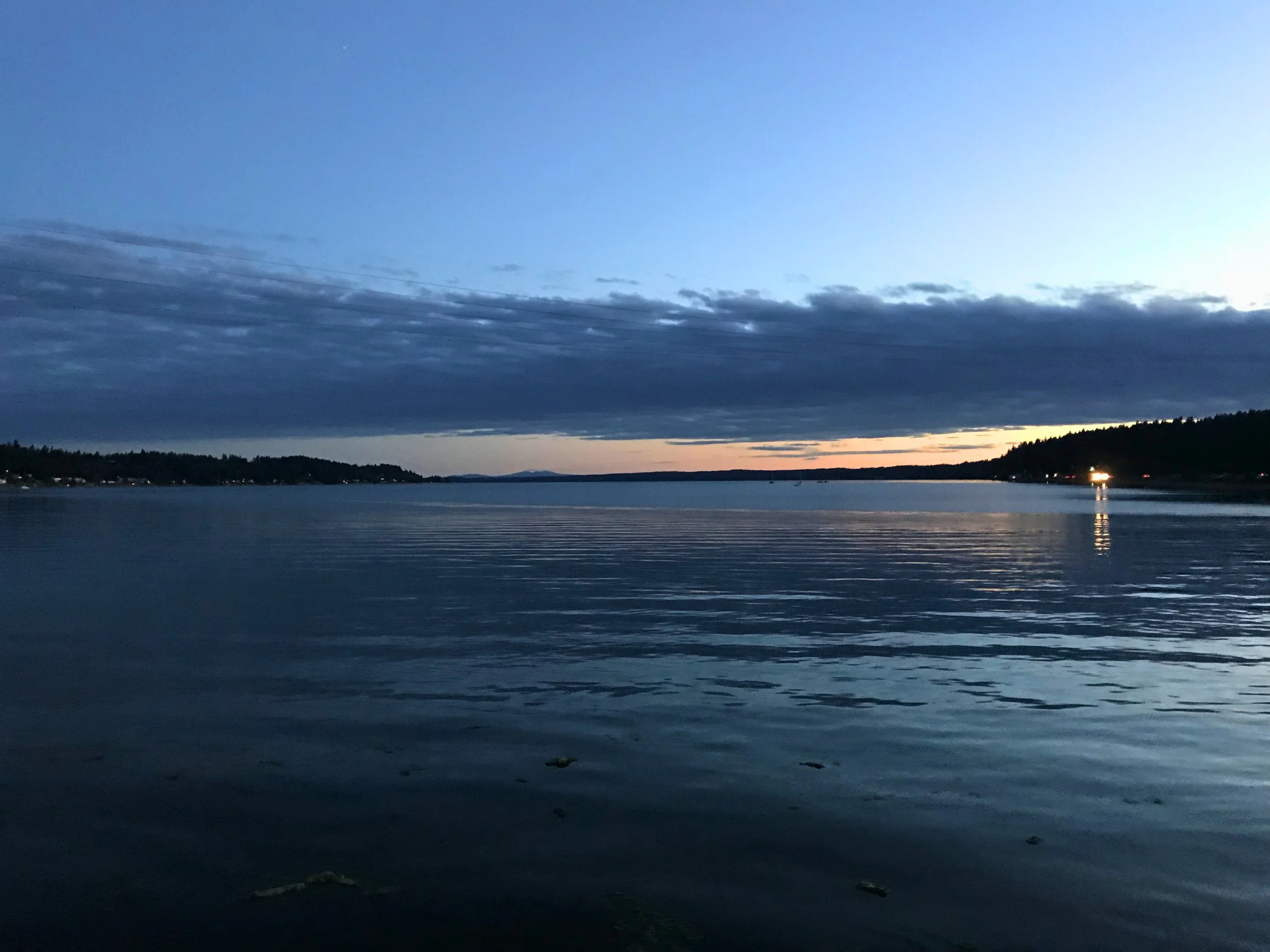 Peaceful Gig Harbor waterfront at dusk — the backdrop that makes buying your next home here an opportunity unlike anywhere else in the Pacific Northwest
