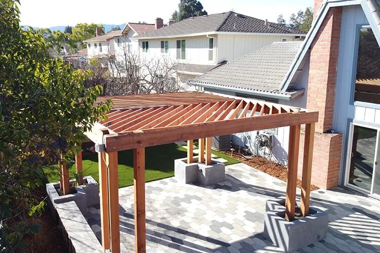 Backyard pergola in New Franklin, OH beside modern pool design