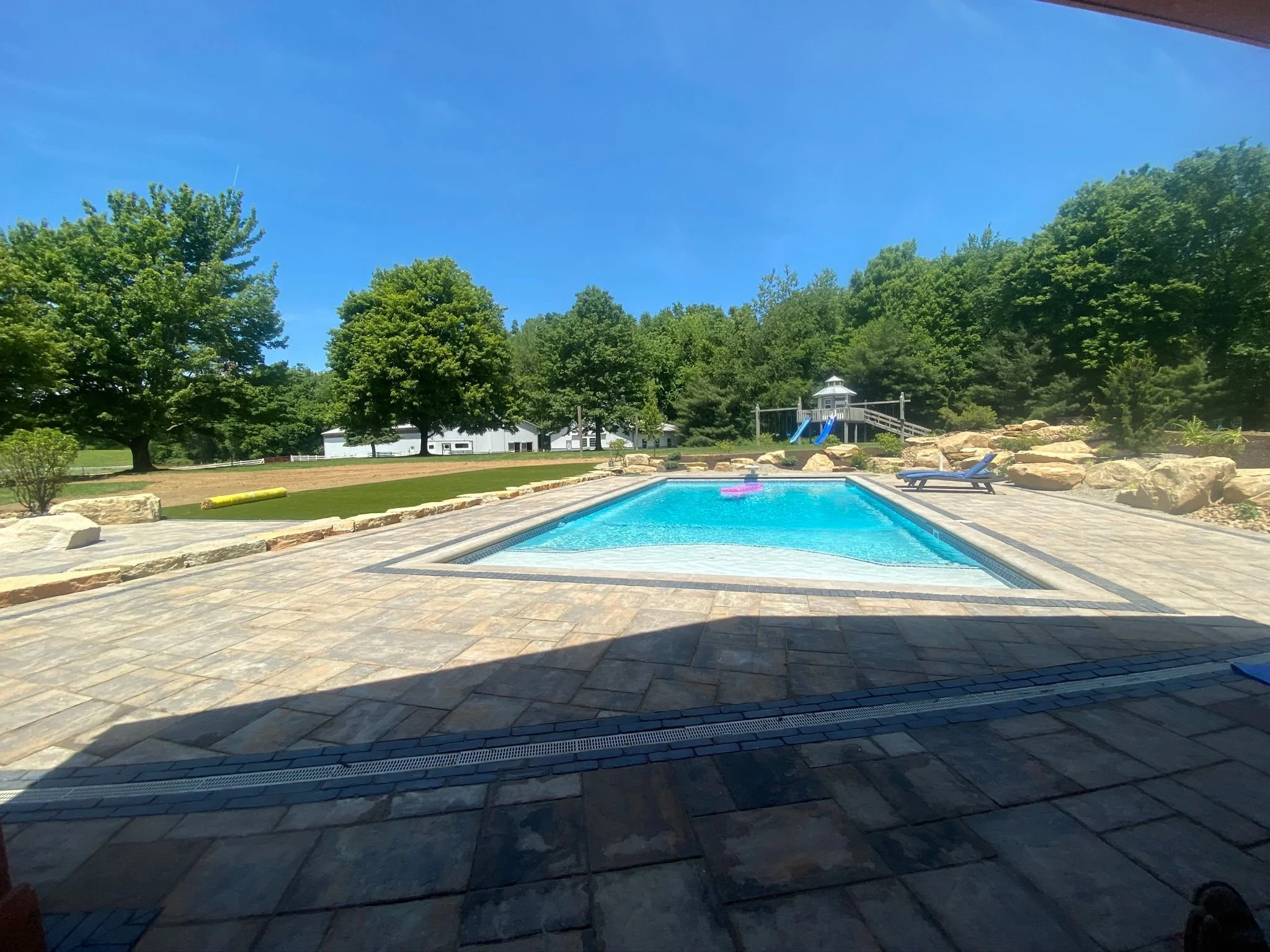 Heat Up and Cool Off with a Fire Pit and Inground Pool in Your Backyard in the Jackson Township, OH, Area