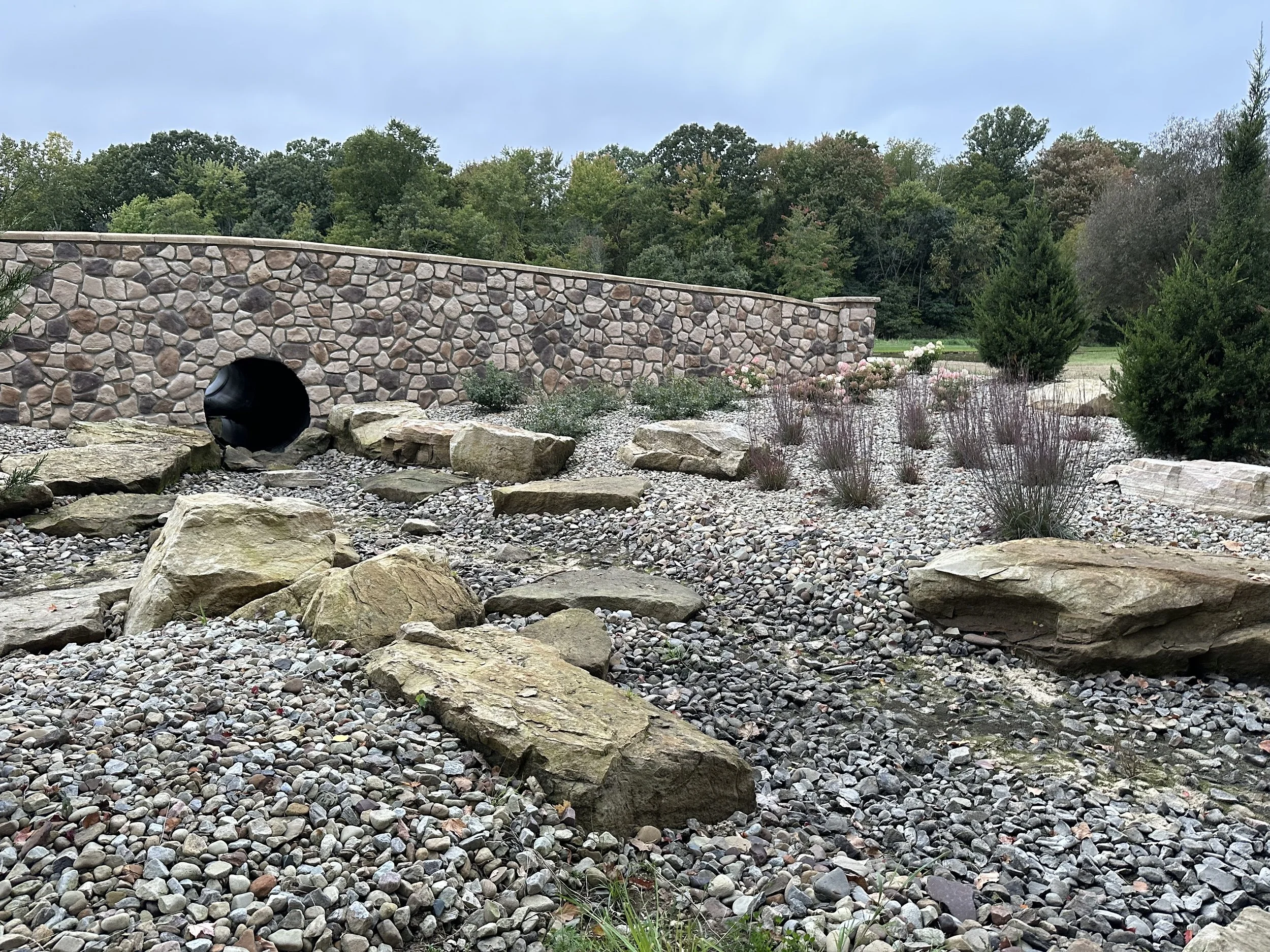 Strengthen and Beautify Your Green, OH Property With a Retaining Wall and Plantings