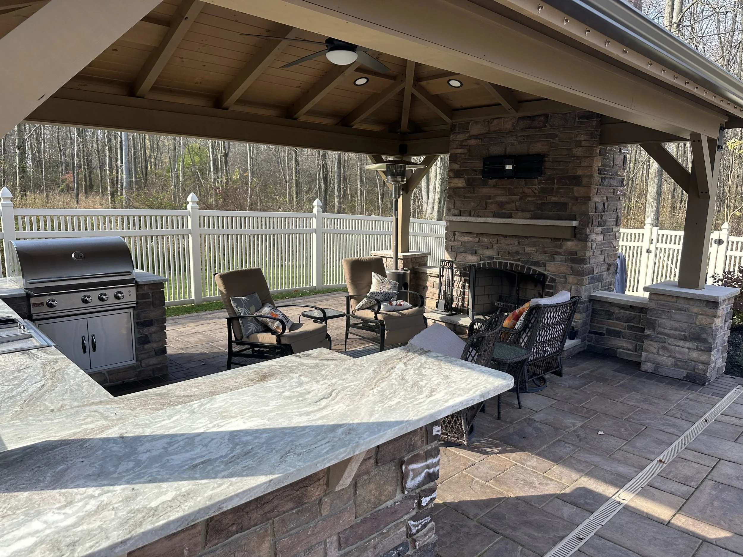 Relax by the Fire: Designing Your Outdoor Fireplace With Lush Plantings in Uniontown, OH