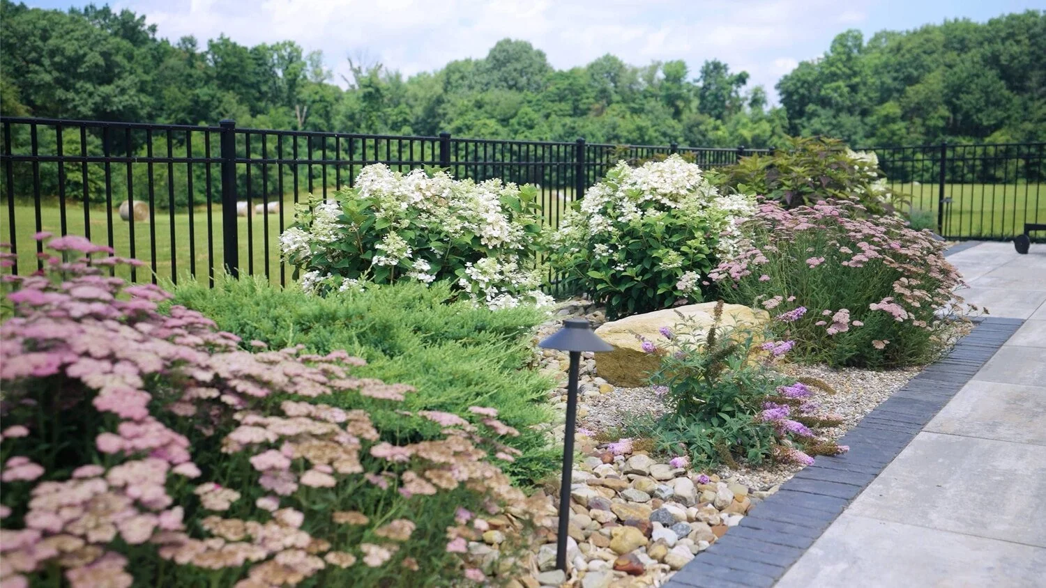 plantings in Massillon, OH combining native shrubs and flowering perennials