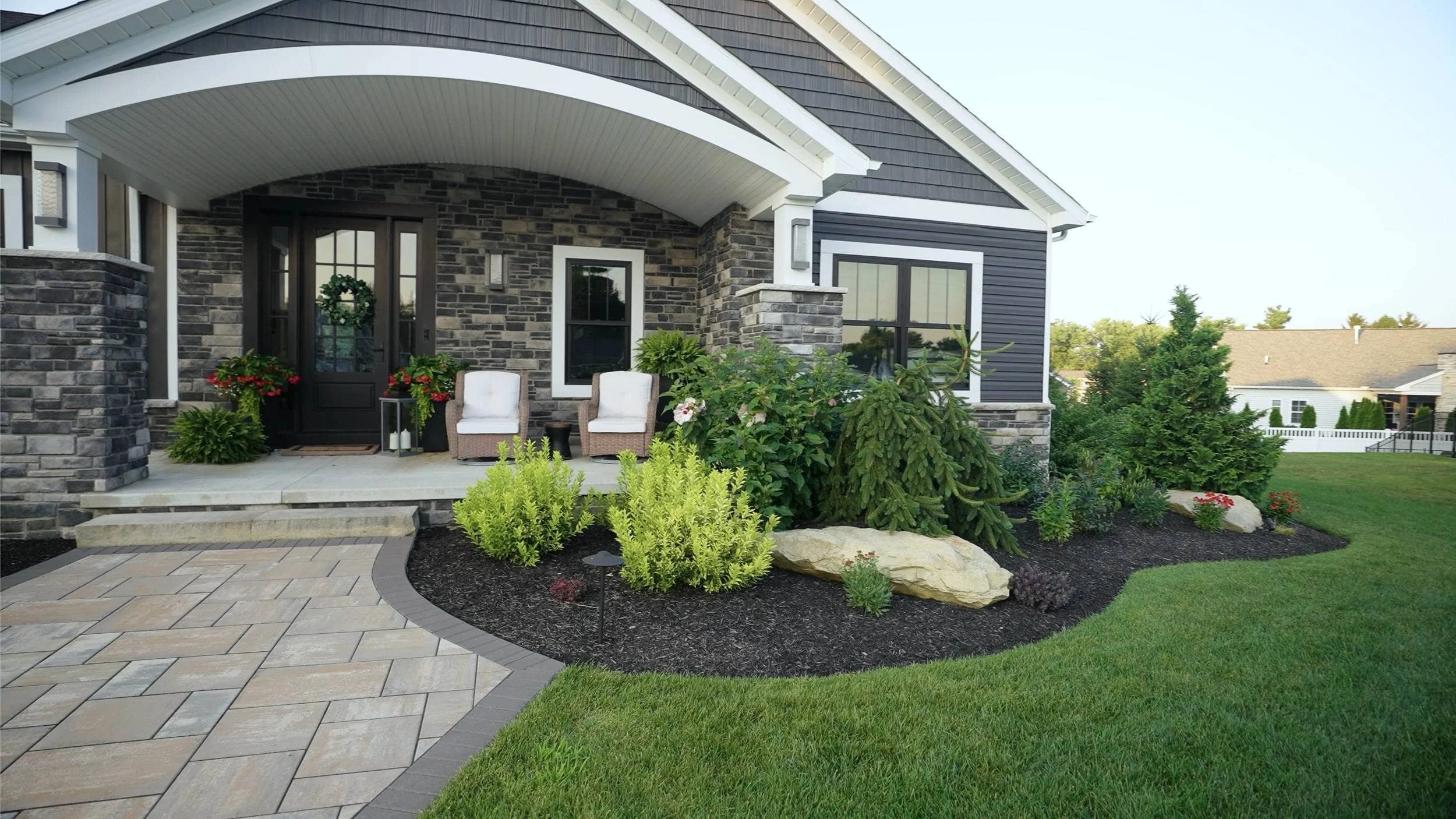 Backyard Design Featuring Walkways and Garden Beds in Lake Township, OH