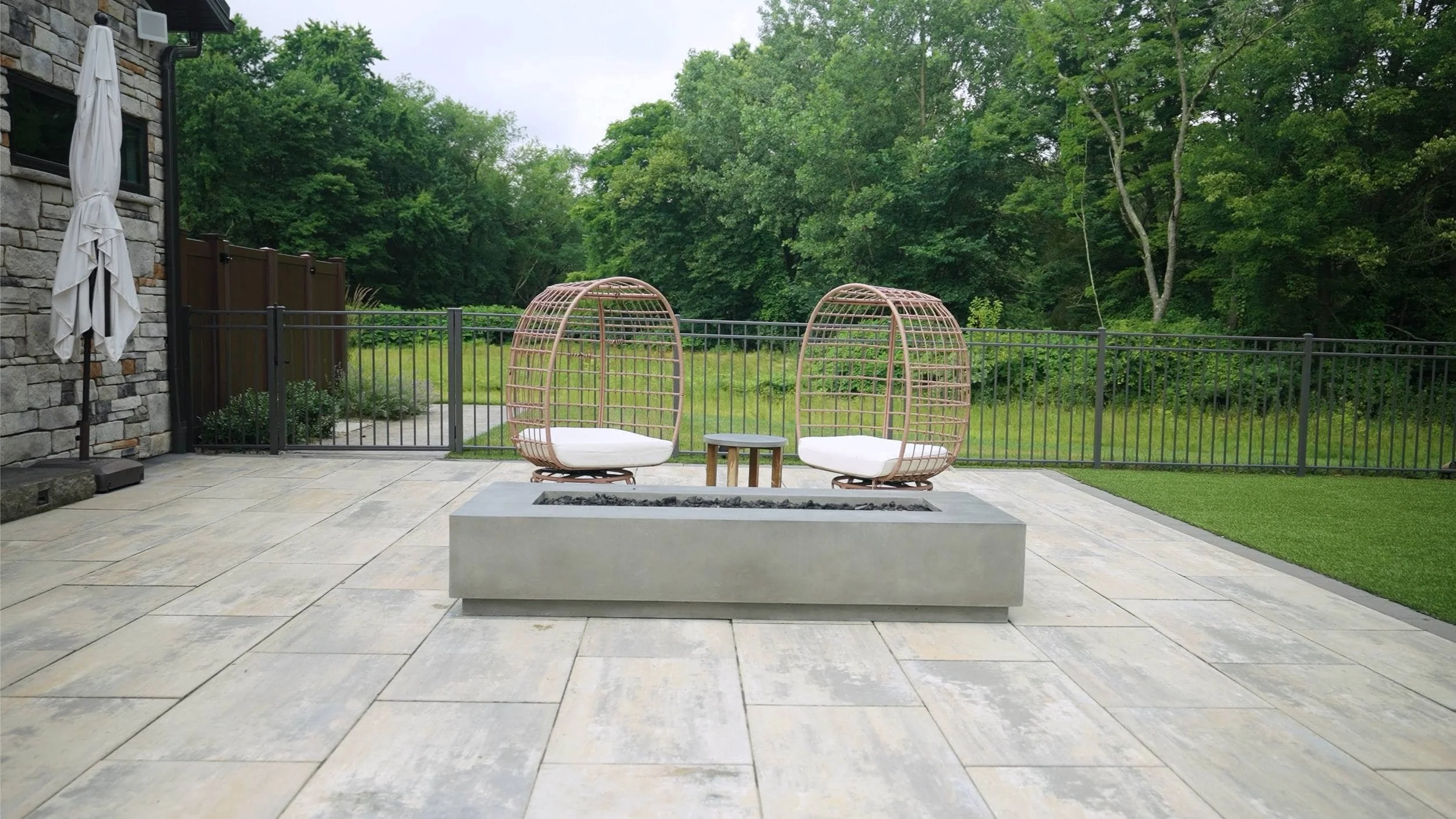 Cozy Backyard Featuring a Stone Fire Pit in North Canton, OH