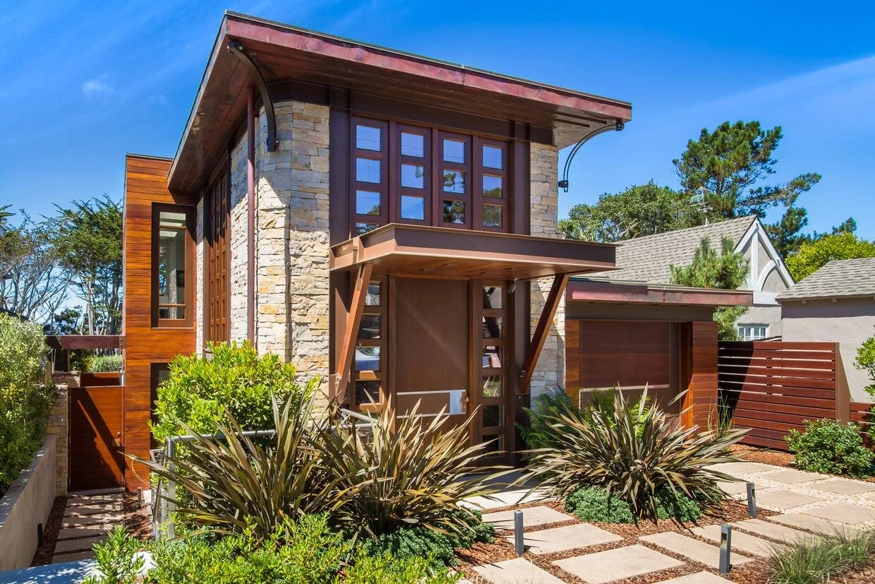A modern residence with stone installed inside and out.