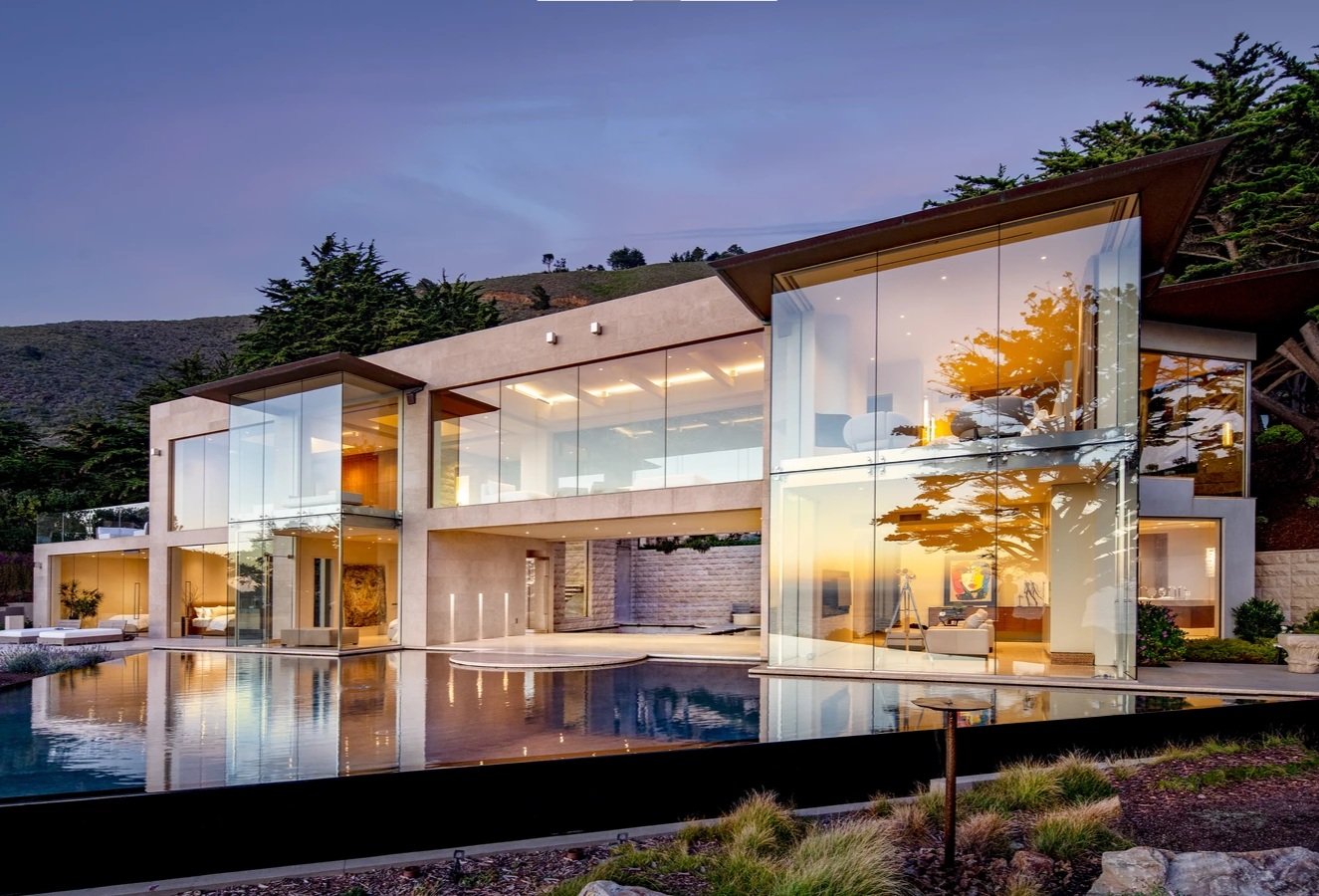 A stunning work of glass and stone, mixing smooth and split face materials from foundation to parapet, inside and out.