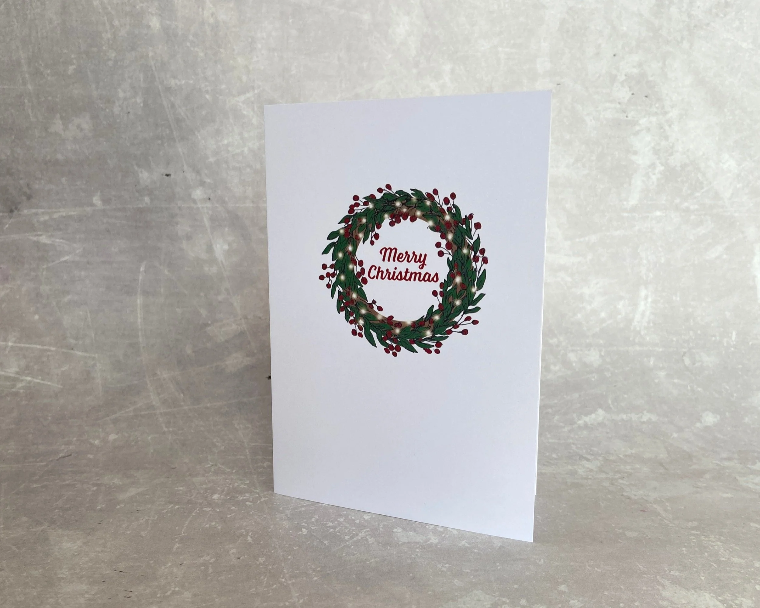 Christmas berry wreath greetings card by Devon artist Helen Leslie Illustrator