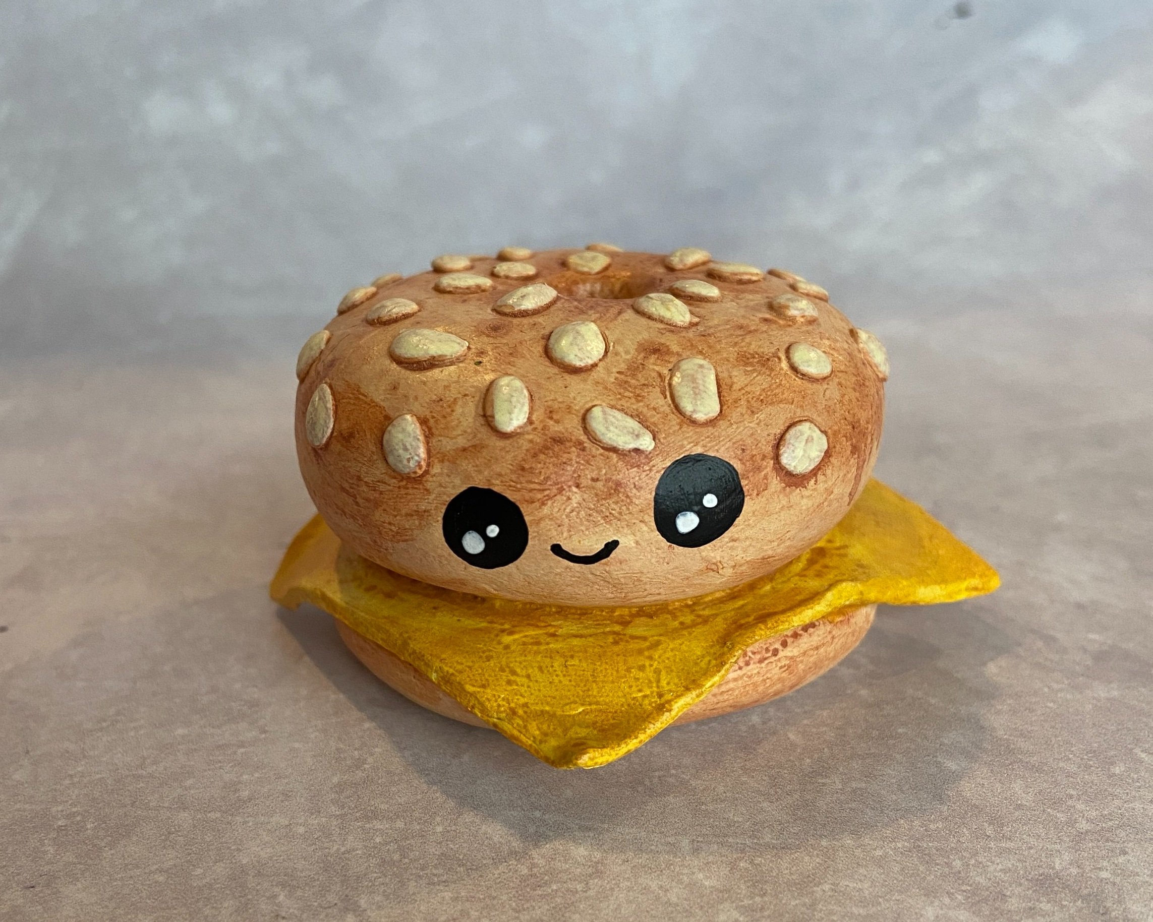 Sesame bagel cute clay character desk buddy handmade by Devon artist Helen Leslie Illustrator