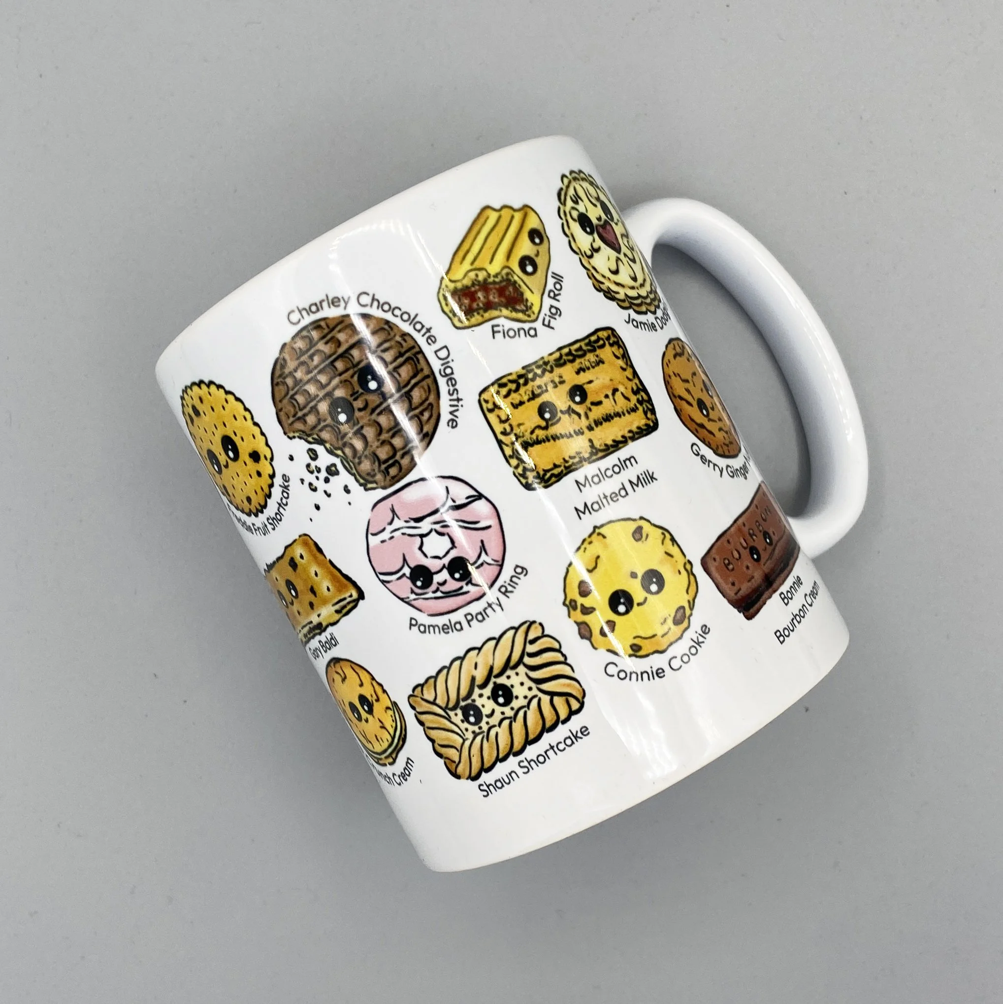 Biscuit Besties mug full of tea dunking favourite biscuits with alliterative names for a splash of humour! Perfect for a nice cup of tea. By Devon artist Helen Leslie Illustrator