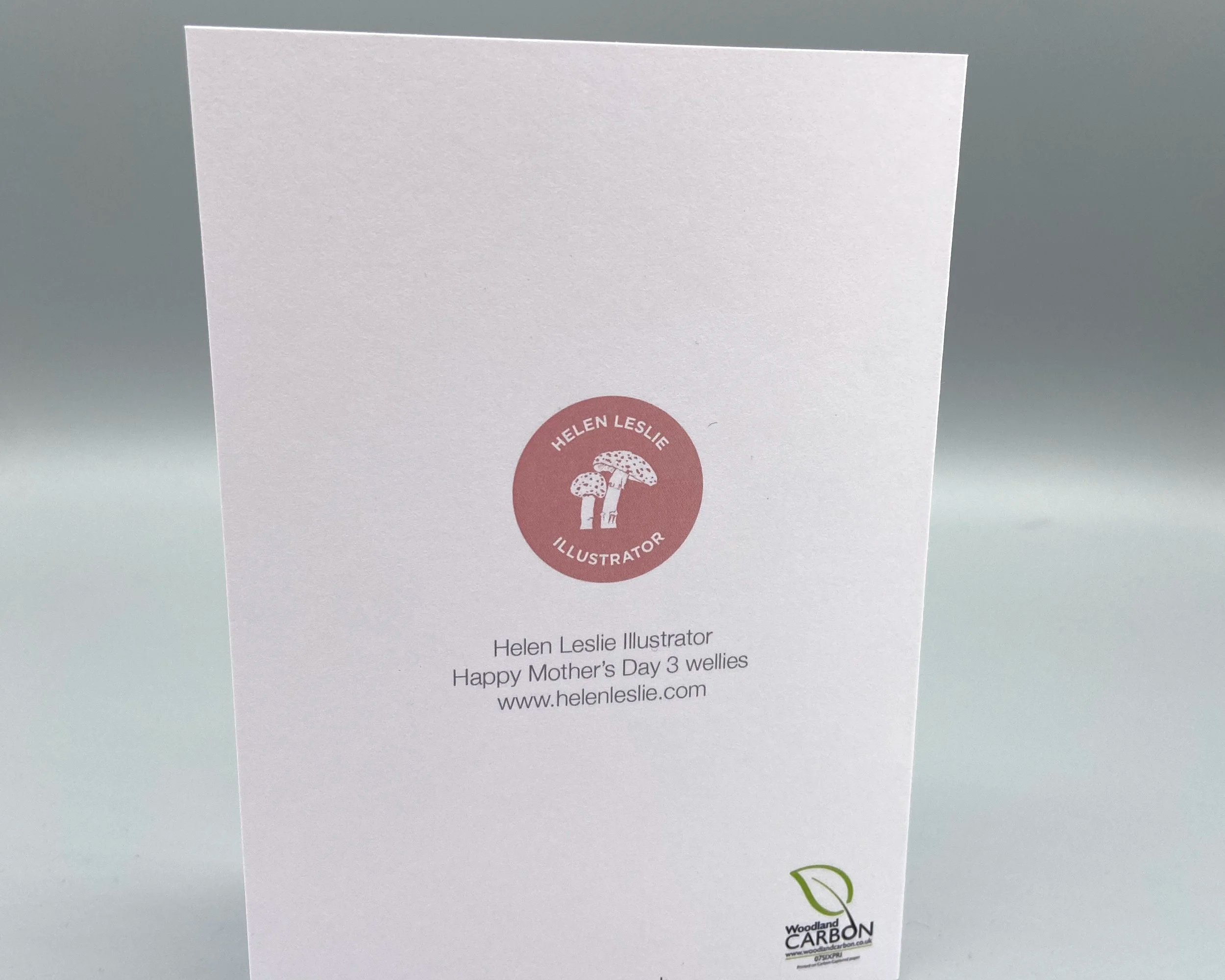 Happy Mother's Day card with mum's welly boots and two pairs of kids' wellies illustrated by Devon artist Helen Leslie Illustrator