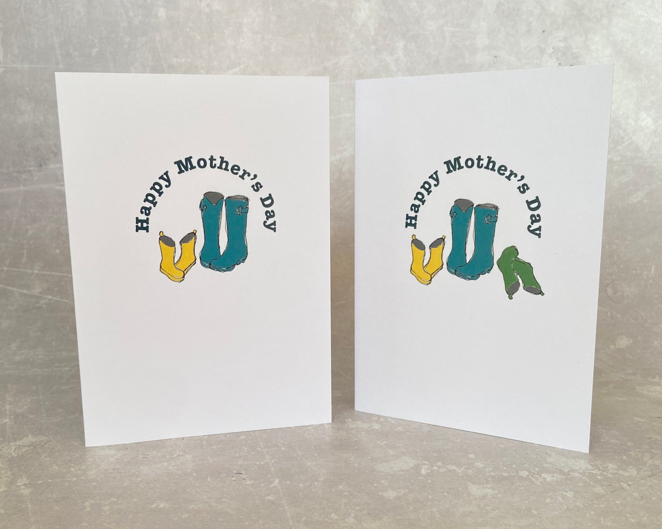 Mother's Day card with Happy Mother's Day greeting featuring 2 pairs of children's wellies and mum's wellies - cute card for a mum of two little ones