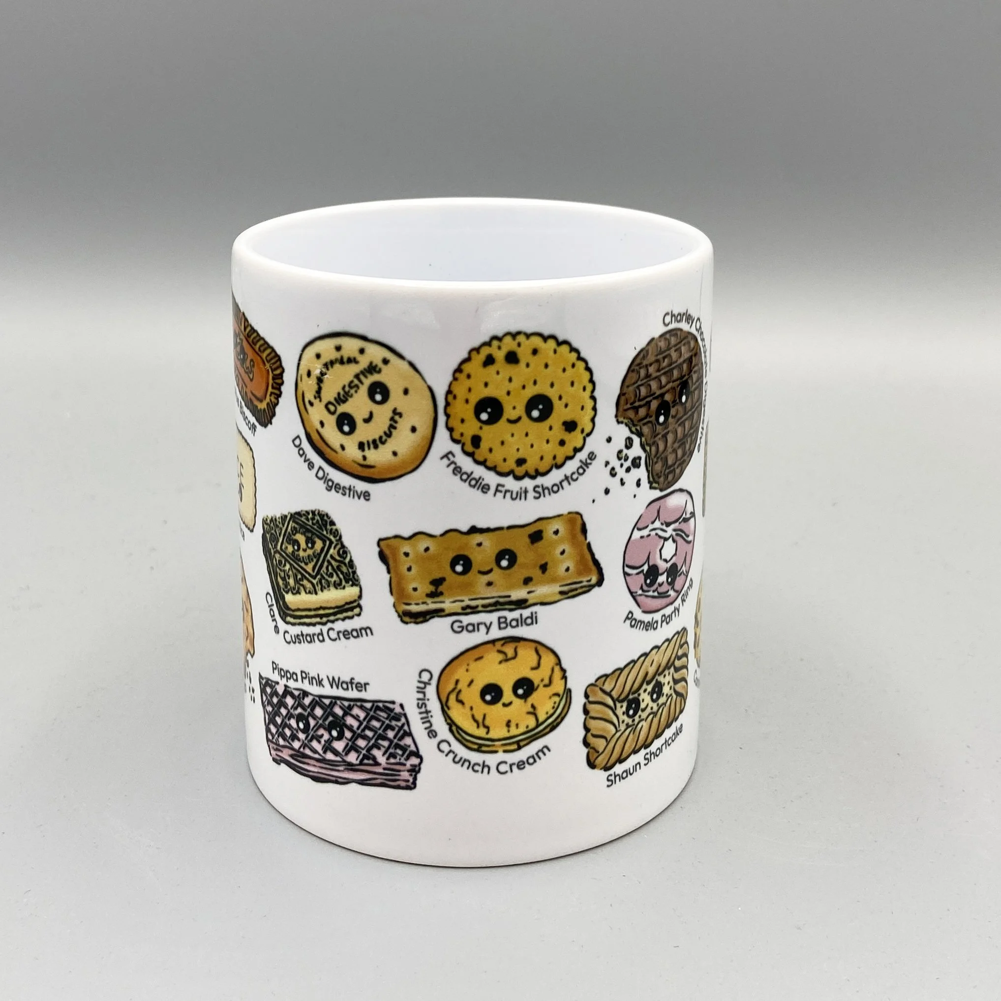 Biscuit Besties mug full of tea dunking favourite biscuits with alliterative names for a splash of humour! Perfect for a nice cup of tea. By Devon artist Helen Leslie Illustrator