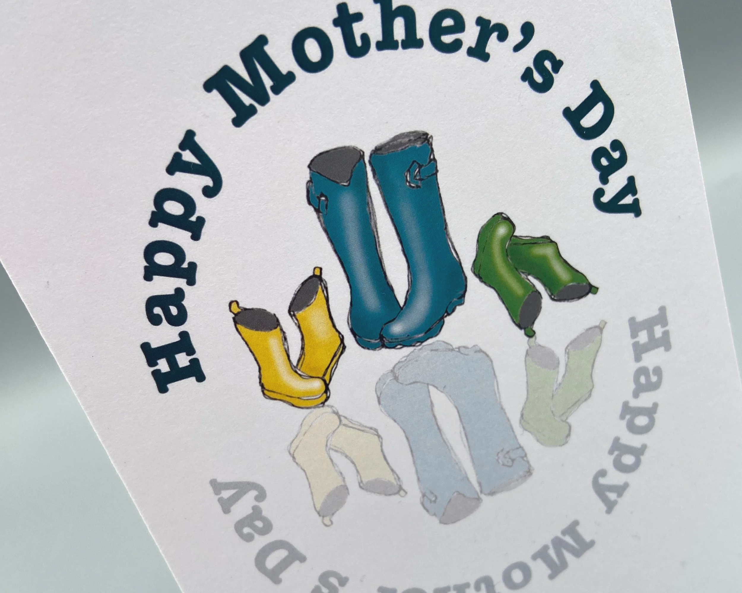 Happy Mother's Day card with mum's welly boots and two pairs of kids' wellies illustrated by Devon artist Helen Leslie Illustrator