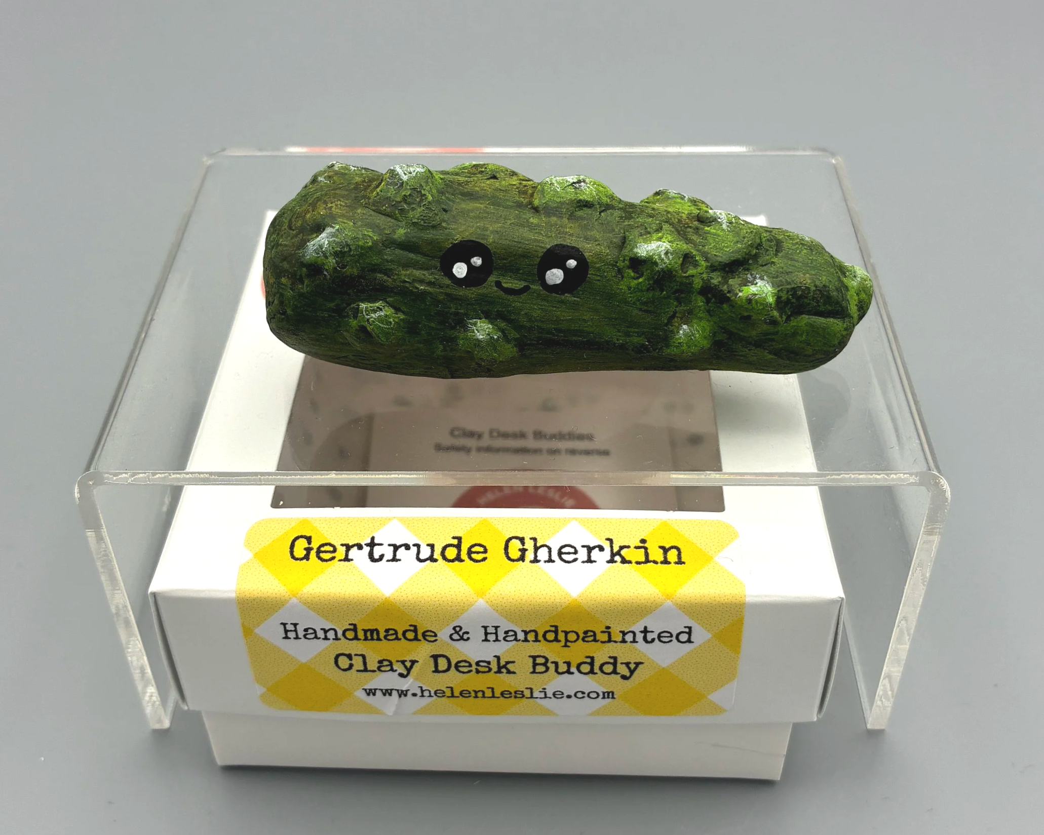 Gherkin pickle cute handmade handpainted clay desk buddy by Devon artist Helen Leslie Illustrator