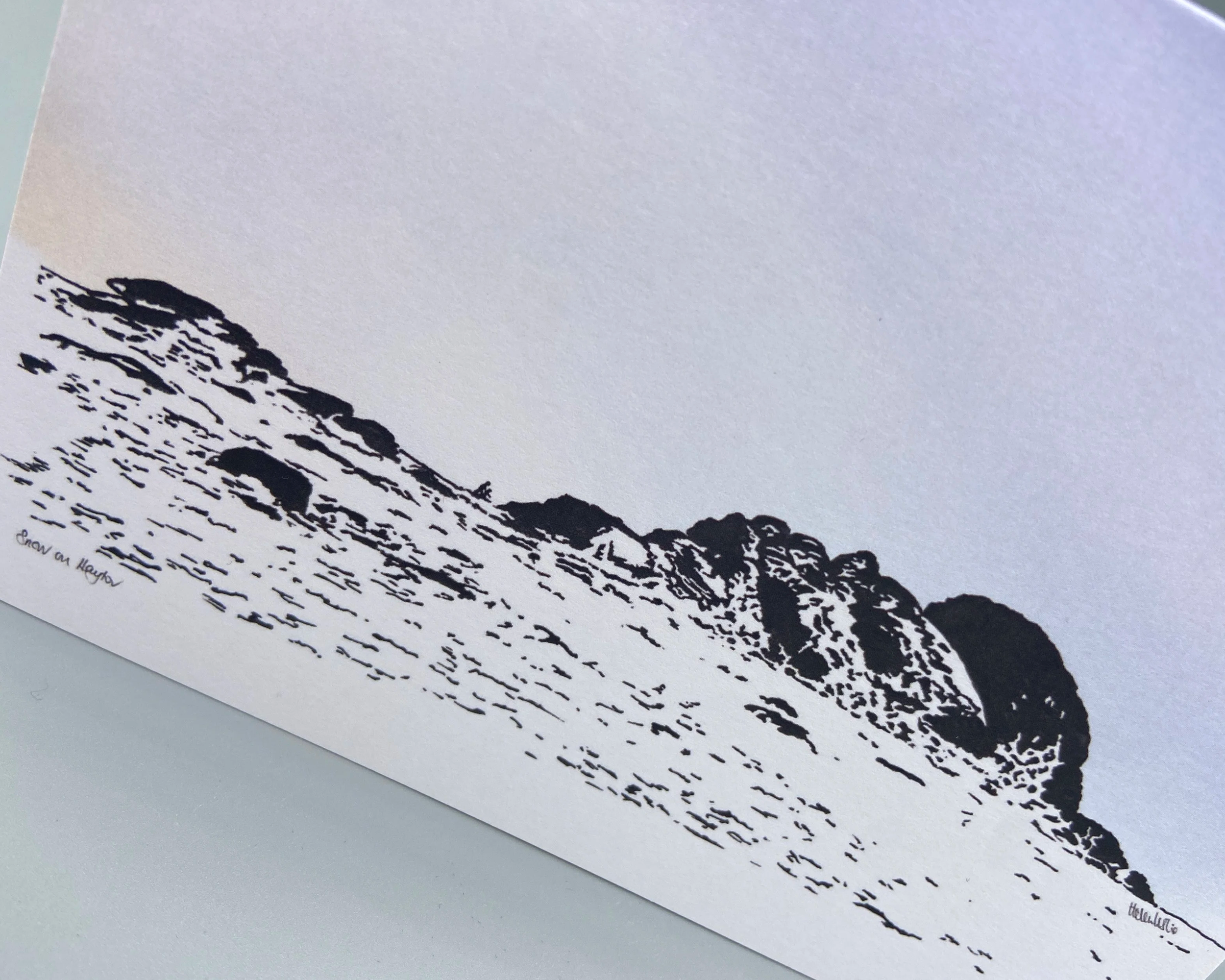 Haytor on a snowy day at dusk, on Dartmoor in Devon. Illustrated by Devon artist Helen Leslie