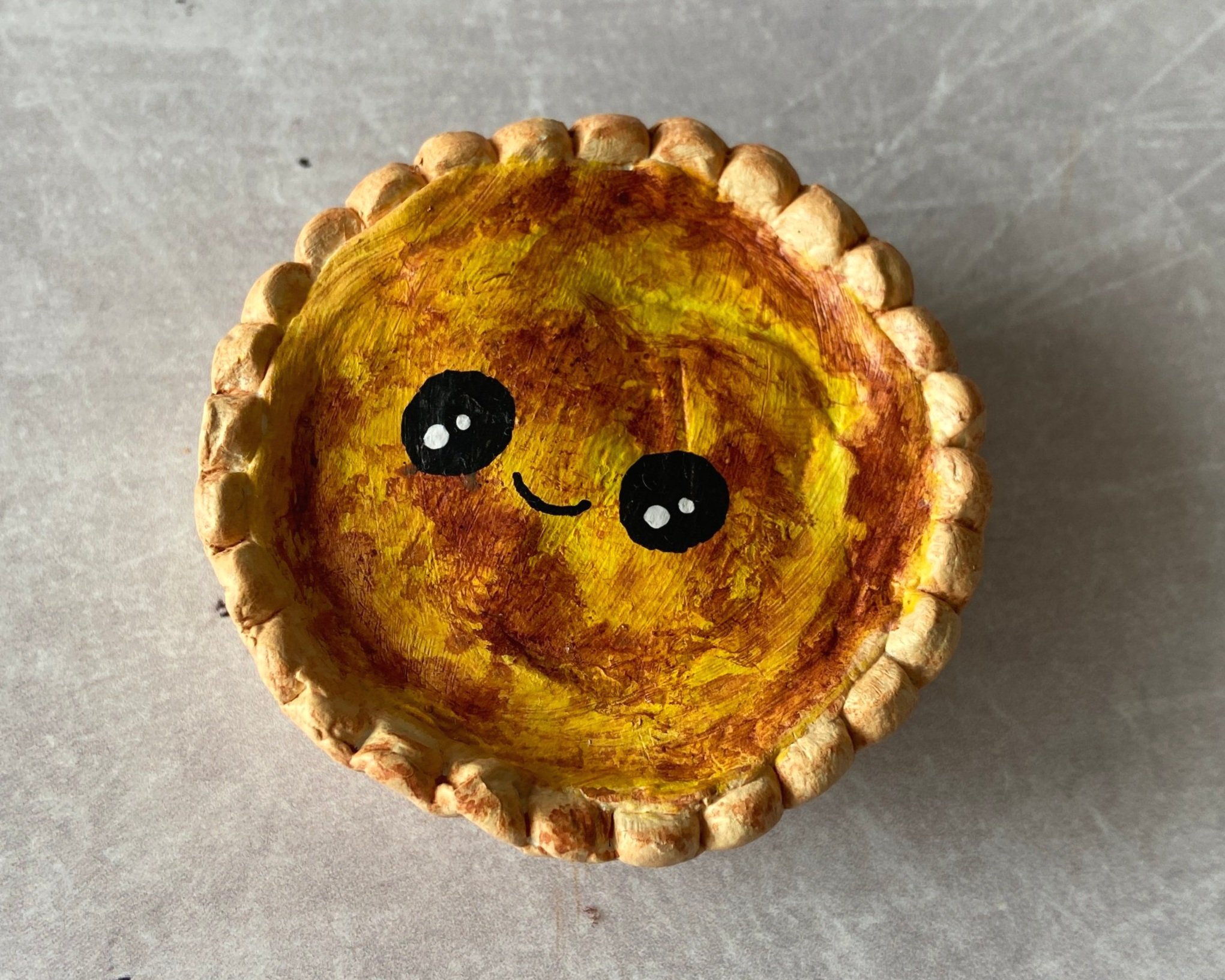 Egg custard tart cute clay character desk buddy handmade by Devon artist Helen Leslie Illustrator