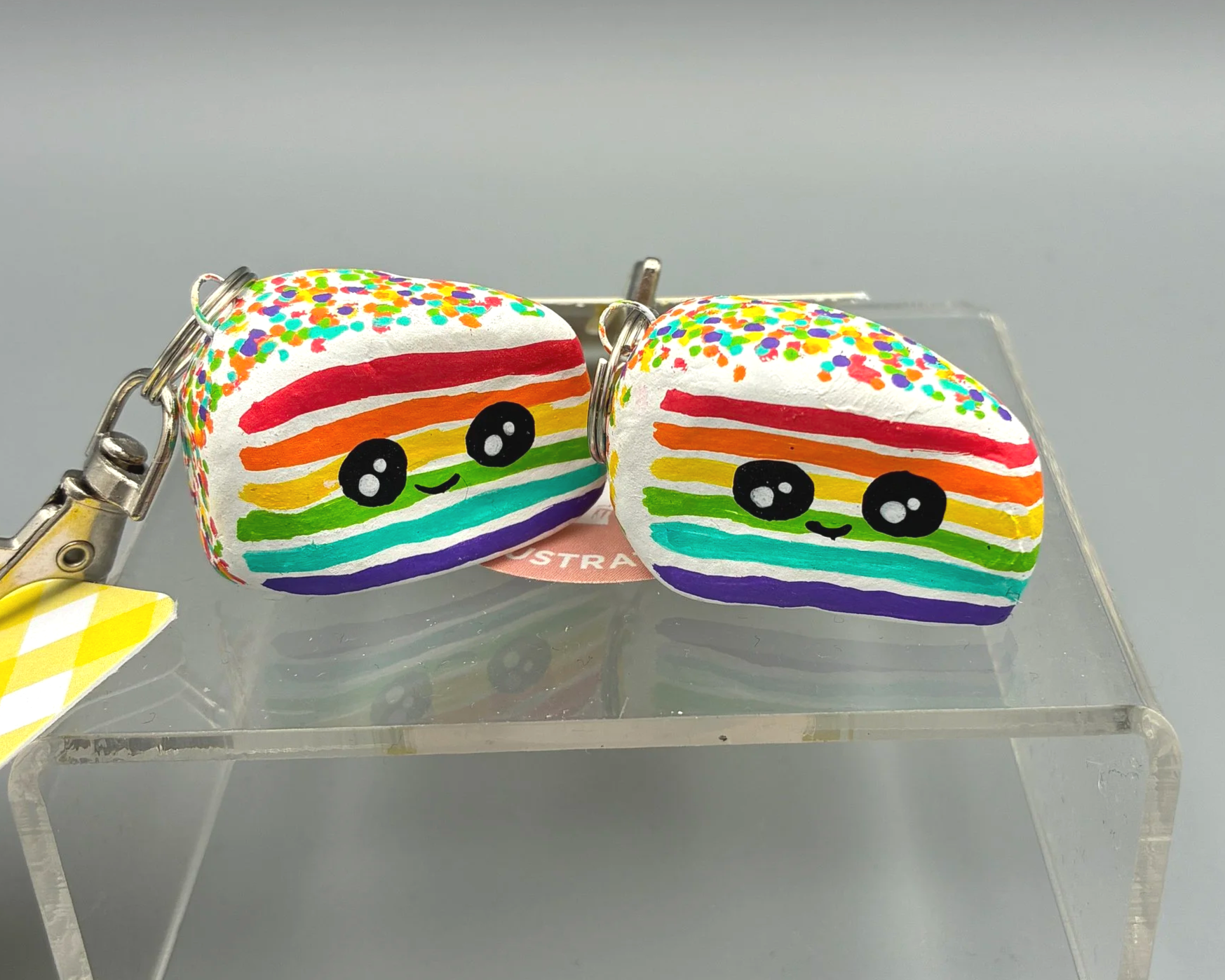 Rainbow cake clay bag charm keychain keyring handmade by Devon artist Helen Leslie Illustrator