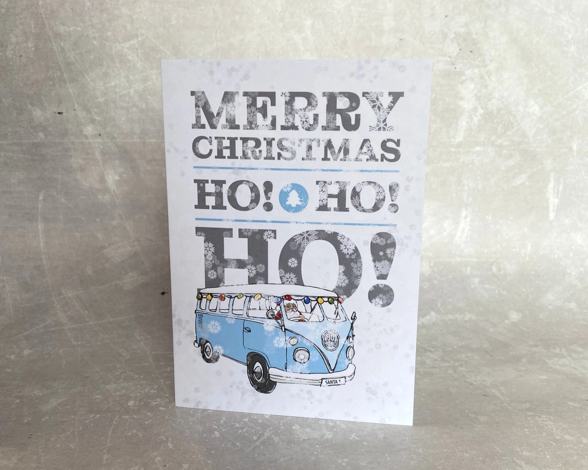 Merry Christmas snowy retro camper van illustrated greetings card by Devon artist Helen Leslie Illustrator
