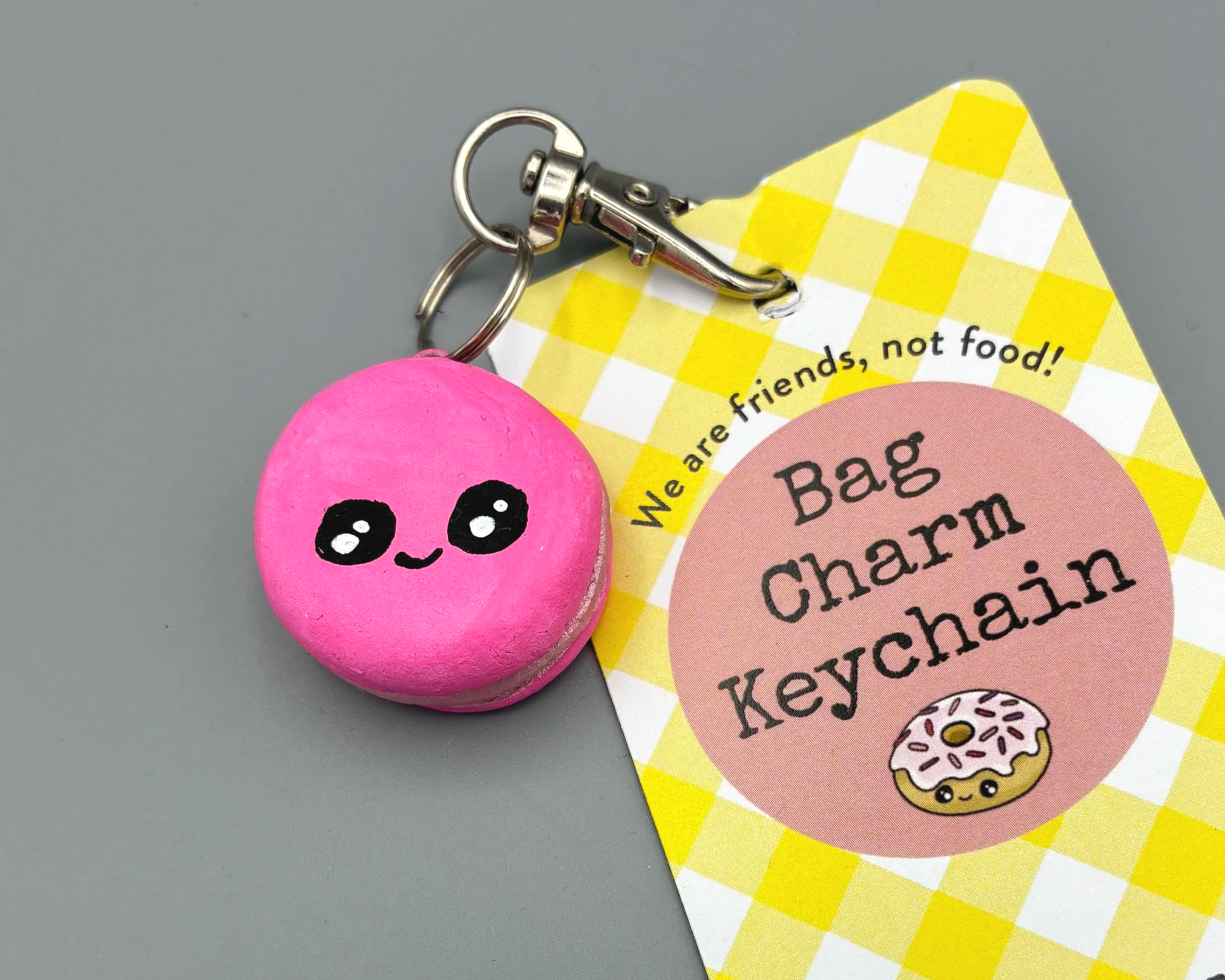 Pink macaron clay bag charm keychain keyring handmade by Devon artist Helen Leslie Illustratorg