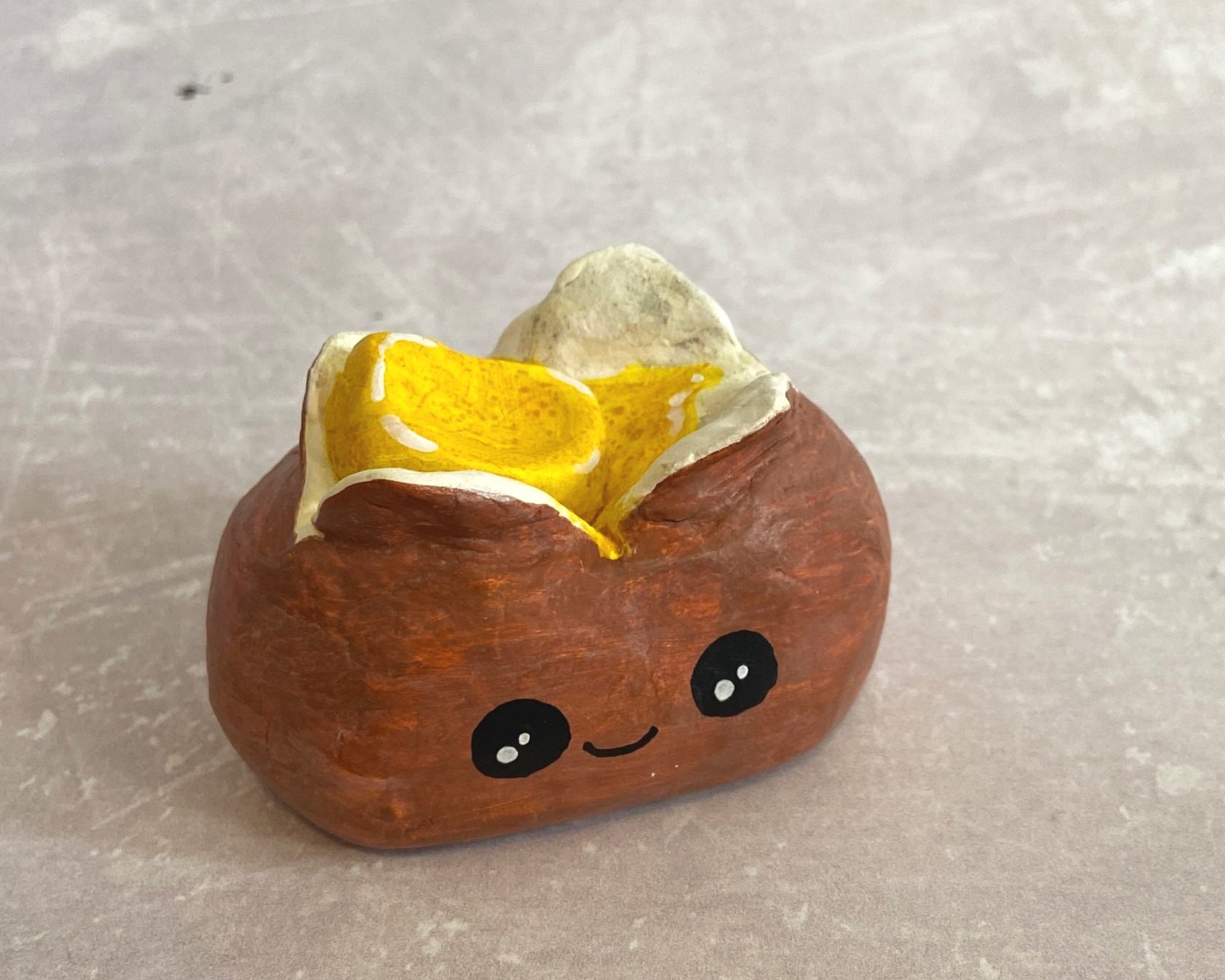 Jacket potato cute clay character desk buddy handmade by Devon artist Helen Leslie Illustrator