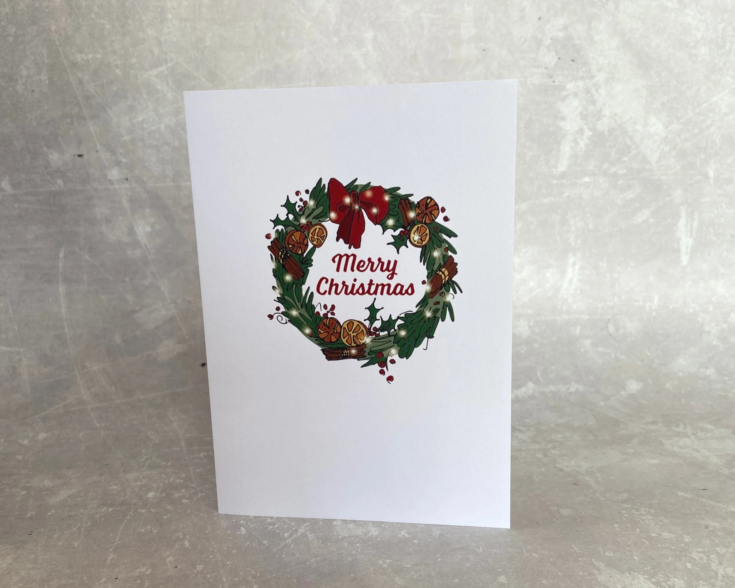 Merry Christmas traditional wreath illustrated greetings card by Devon artist Helen Leslie Illustrator