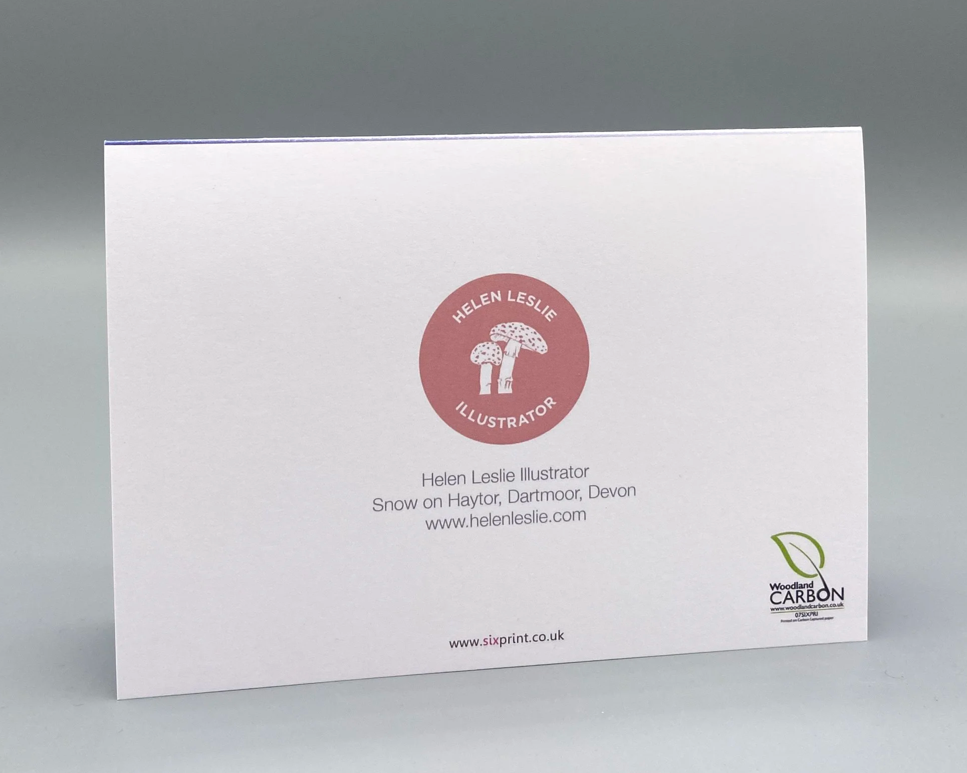 Haytor on a snowy day at dusk, on Dartmoor in Devon. Illustrated by Devon artist Helen Leslie