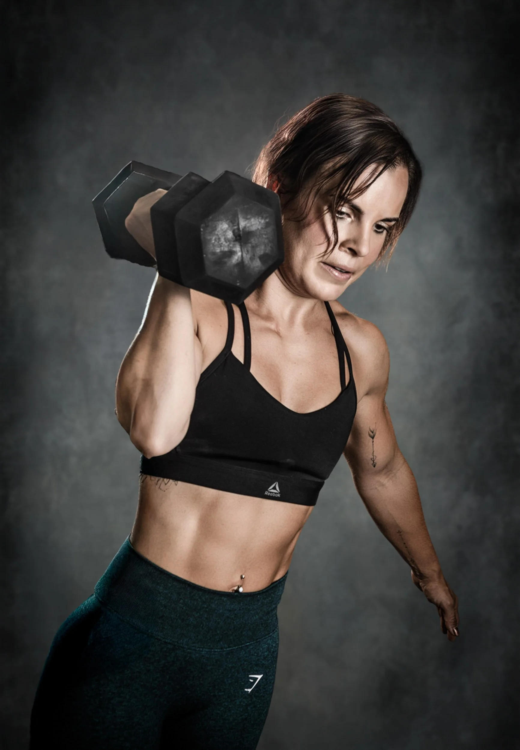 Strong woman posing with confidence in boudoir session