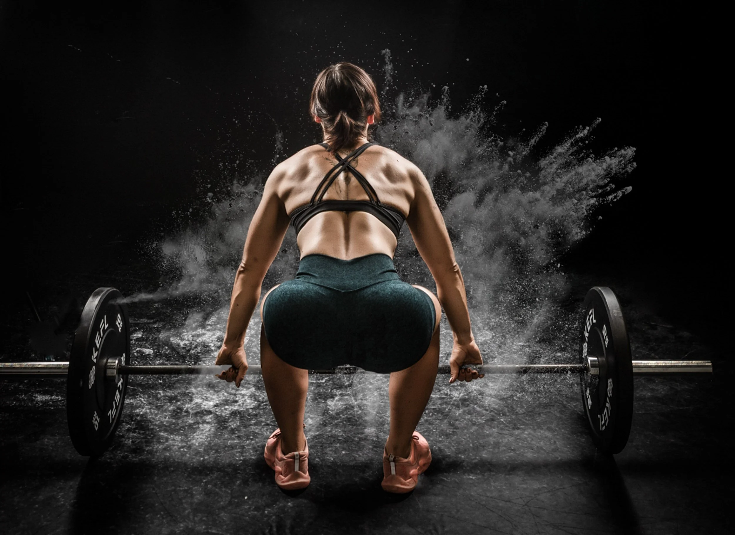 Body building woman in boudoir shoot 