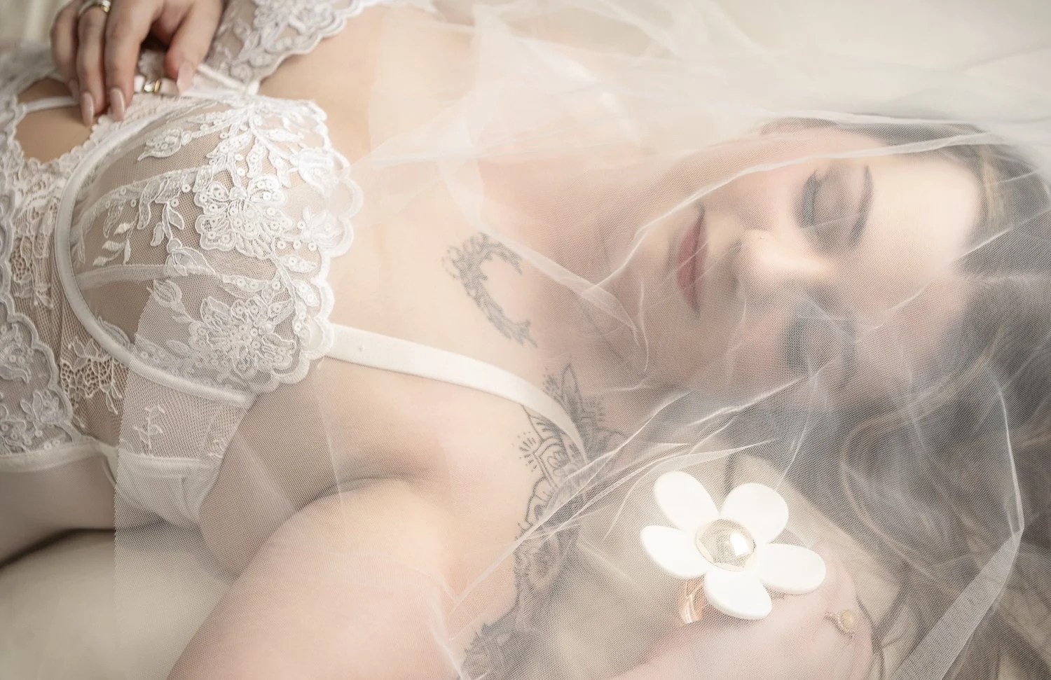 bridal boudoir photograph with daisy perfume 