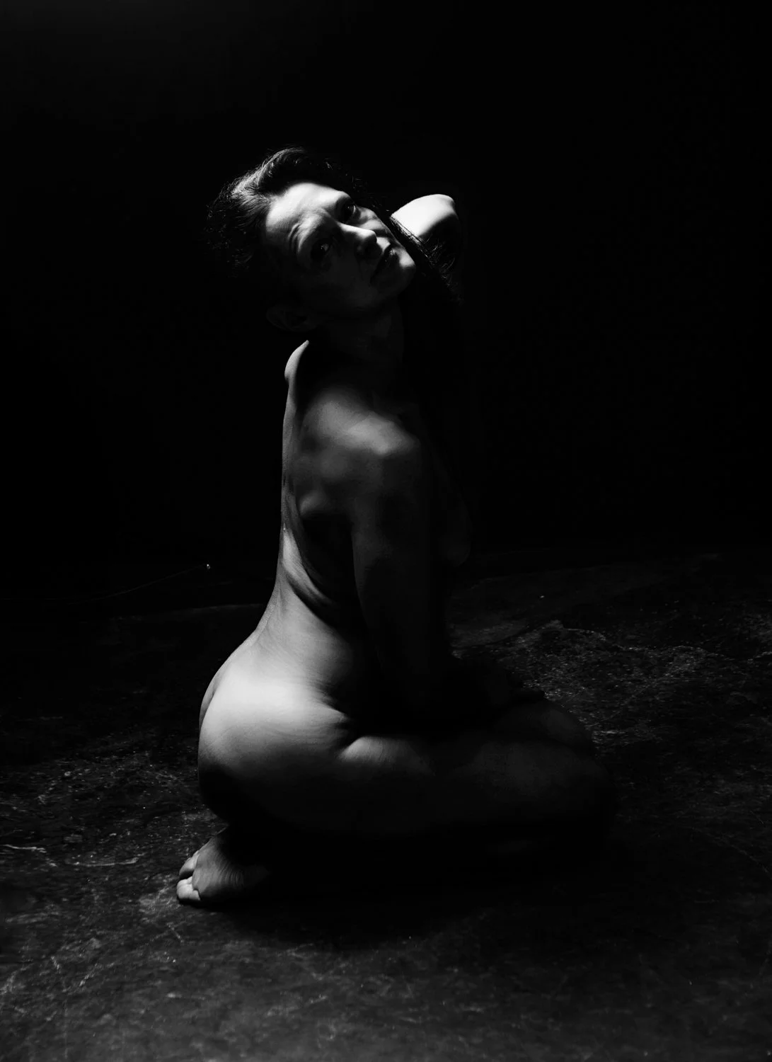 Tasteful boudoir image of confident woman embracing sensuality