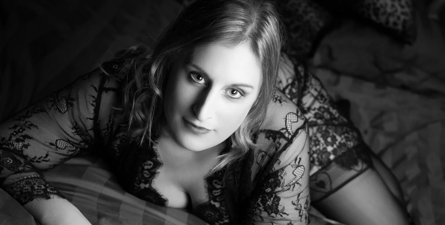 Feminine boudoir image highlighting softness and self-love