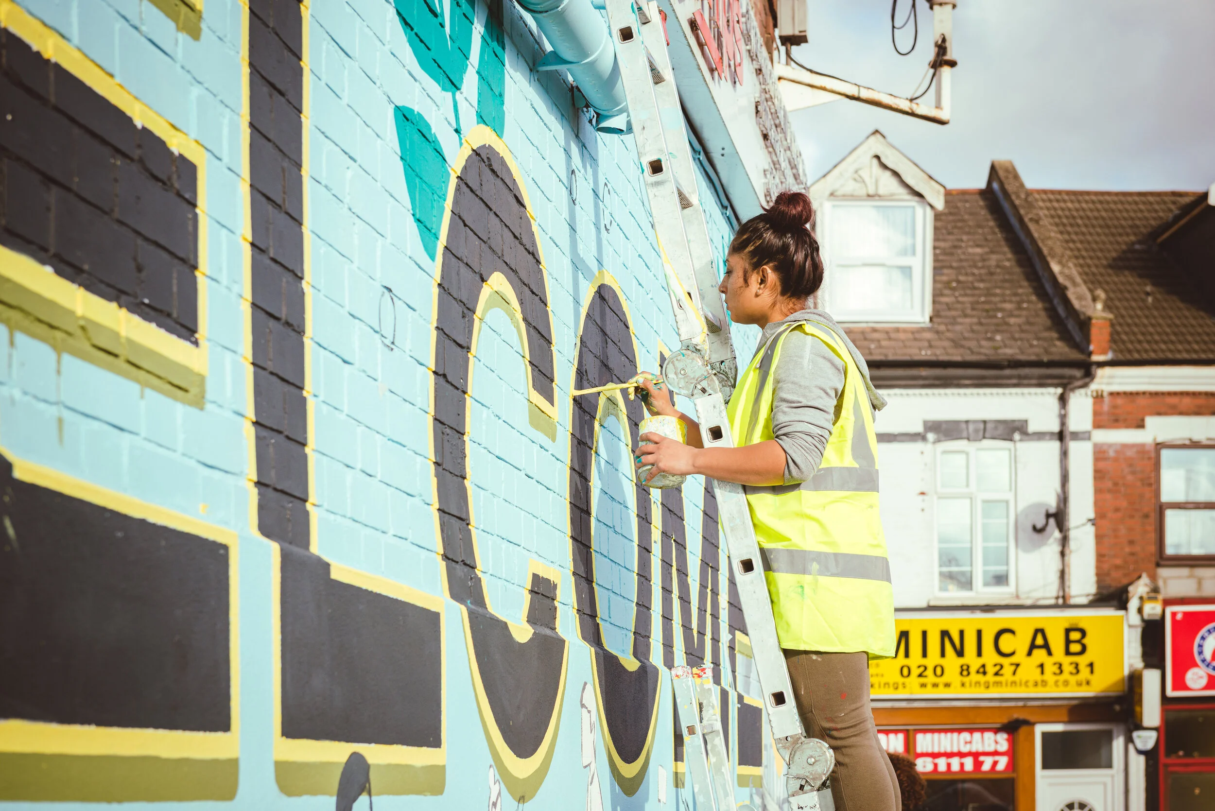 Wealdstone-handpainted-mural-wetheseedscreative-harrowcouncil-art-welcome-sign