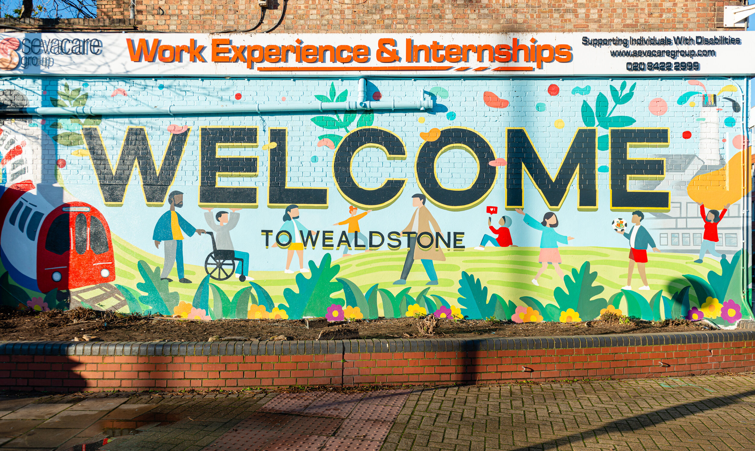 Wealdstone-handpainted-mural-wetheseedscreative-harrowcouncil-art-welcome-sign