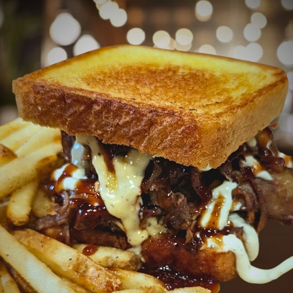 Today's special: 
The Large Mouth Beef is back!! A steak burger topped with smoked brisket, smoked prime rib, cheese sauce, caramelized onions, ranch, and honey bbq all between two pieces of grilled Texas toast!! Served with your choice of a side.

1