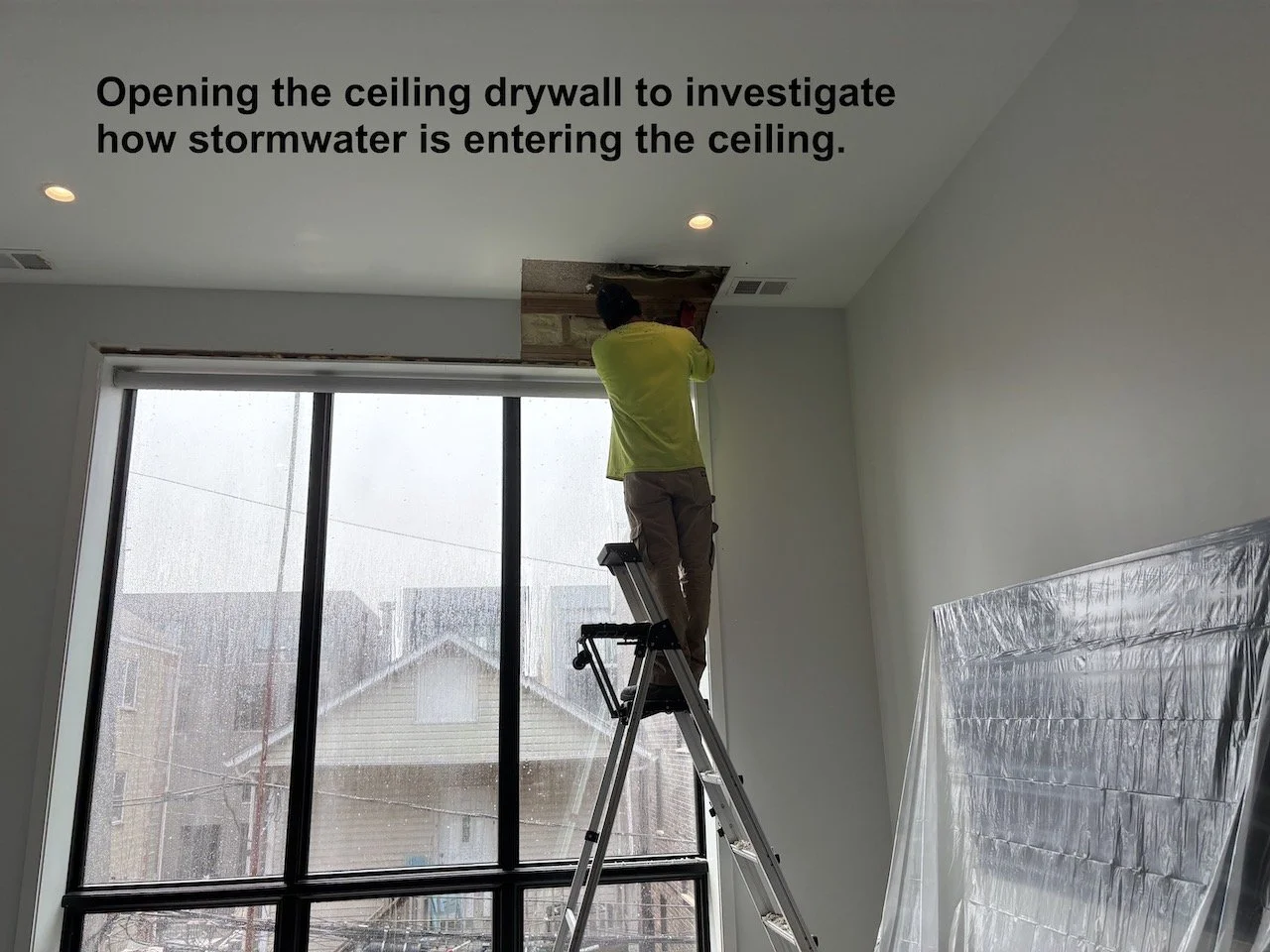 Inspecting Ceiling for Water leaks during test.jpeg