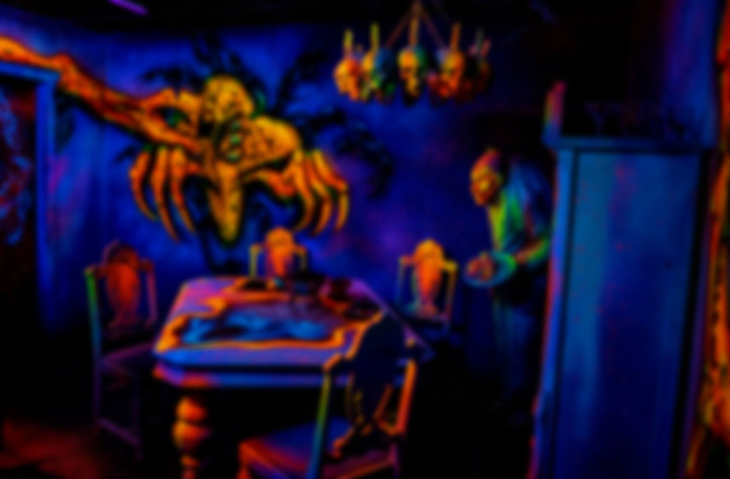 A neon glow illustration of a witch riding a broomstick, with a hanging chandelier and a person standing nearby, all depicted in vibrant blacklight colors.