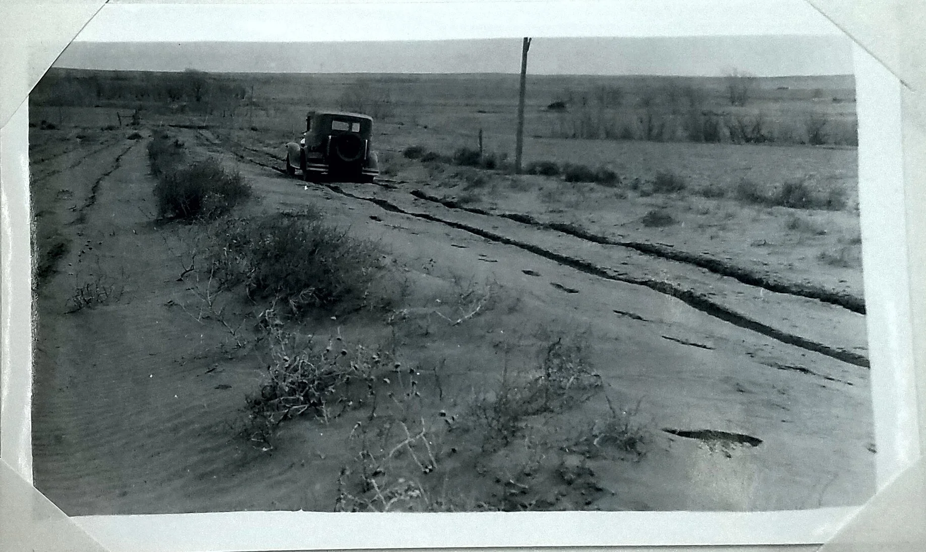 Wind drifted soil 3/4 mile north of the Saline River and 15 miles west of Ellis, Kansas. c. 1934. Figure 19 in Annual Report of Bureau of Agricultural Engineering. National Archives, Record Group 114, Entry 109.