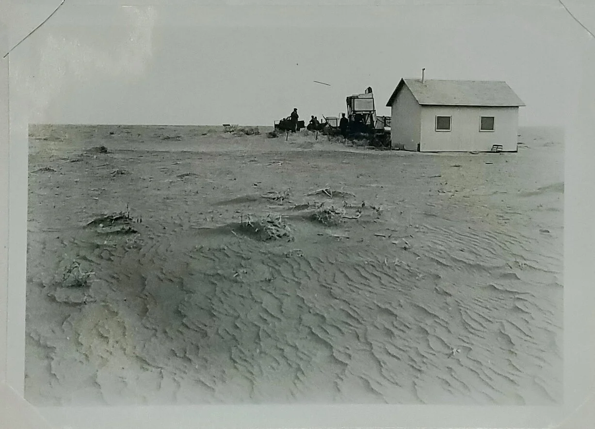 Soil drifted around and over machinery until a combine platform was buried under six inches of soil, southwestern Kansas. c. 1933. Figure 12 in Annual Report Bureau of Chemistry and Soils. National Archives, Record Group 114, Entry 109.